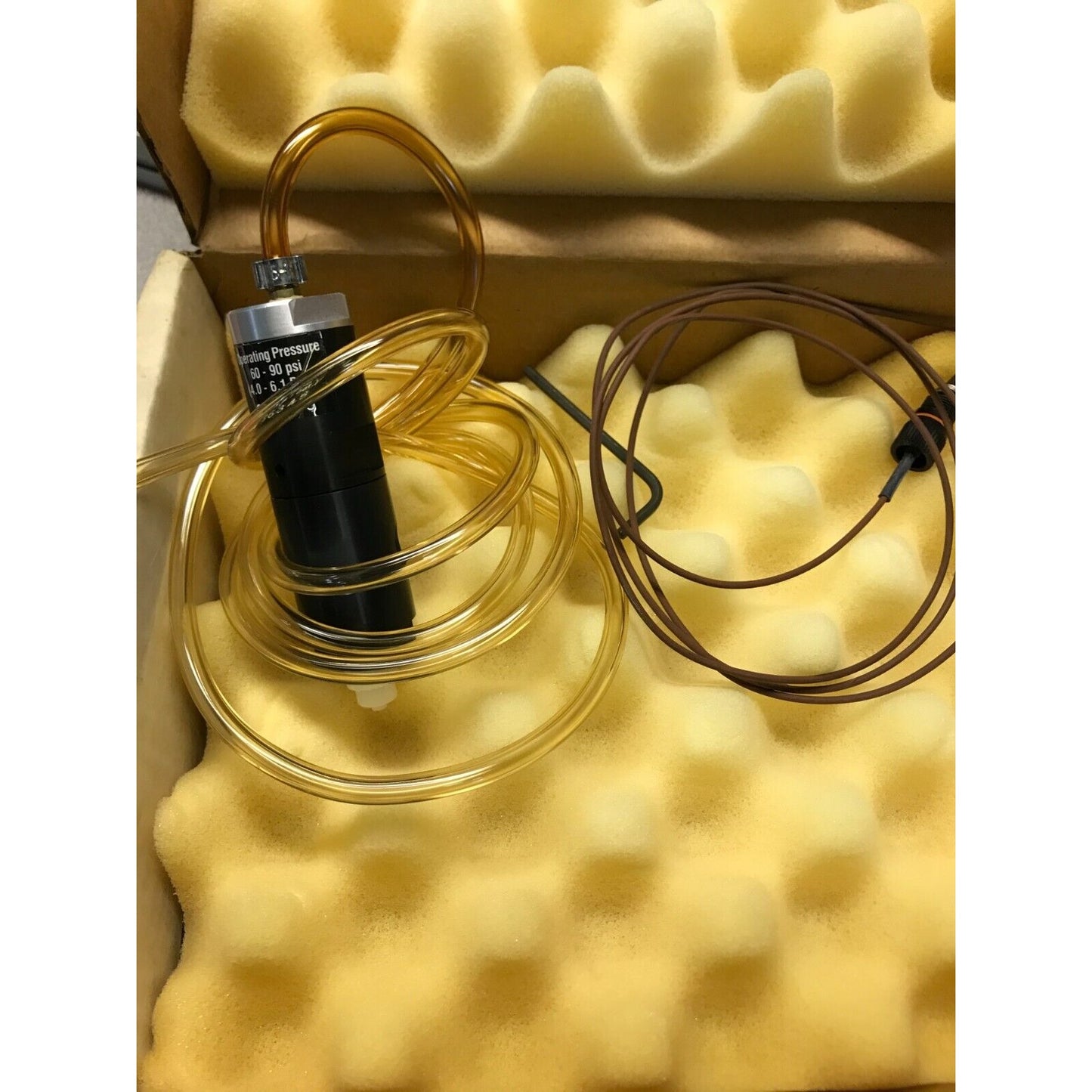 EFD Liquid Metering Valve 86345 valve and hose closeup in packaging