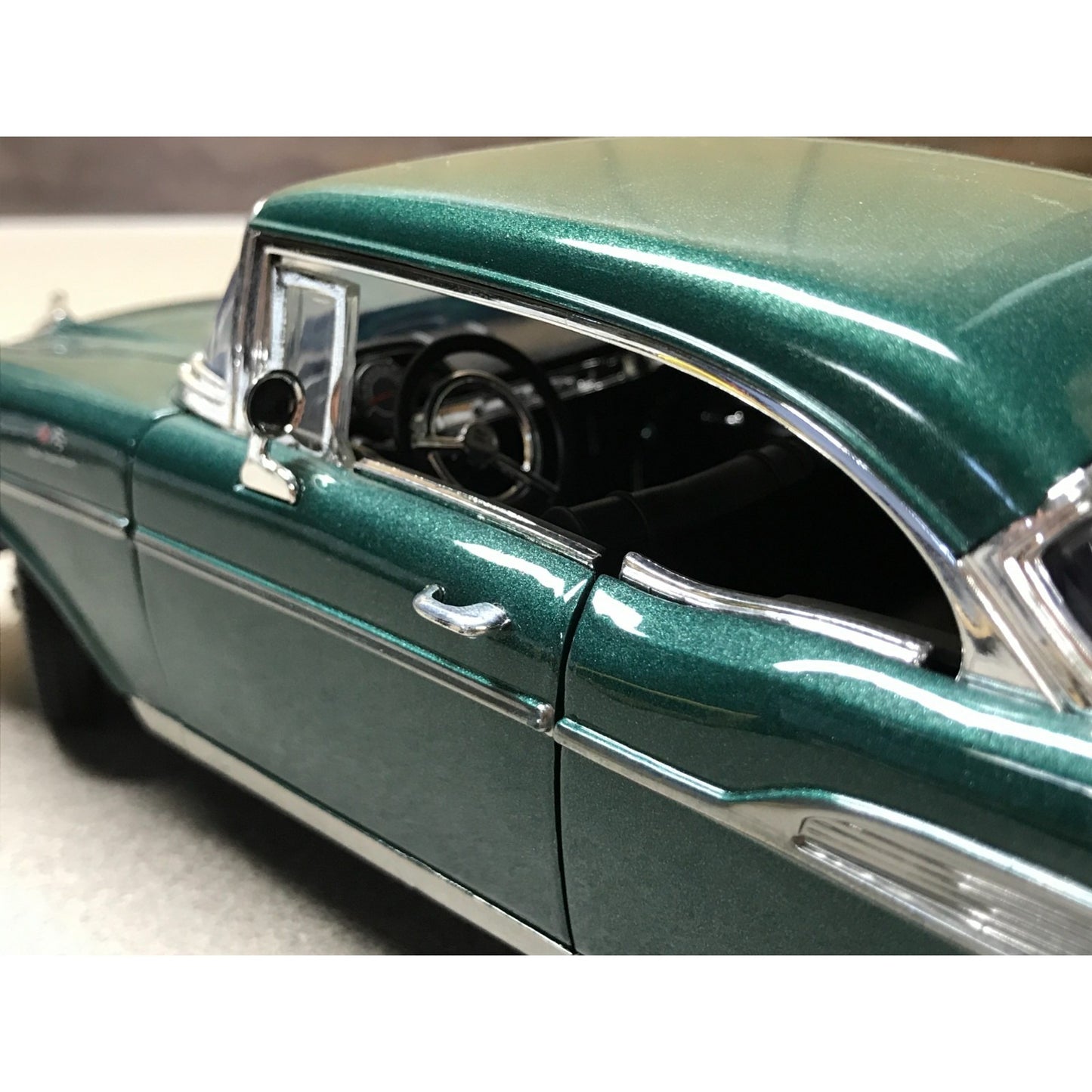 1957 Chevy Bel Air Hardtop Green Die Cast 1:18 Scale - Motor Max No. 73175 closeup of drivers side