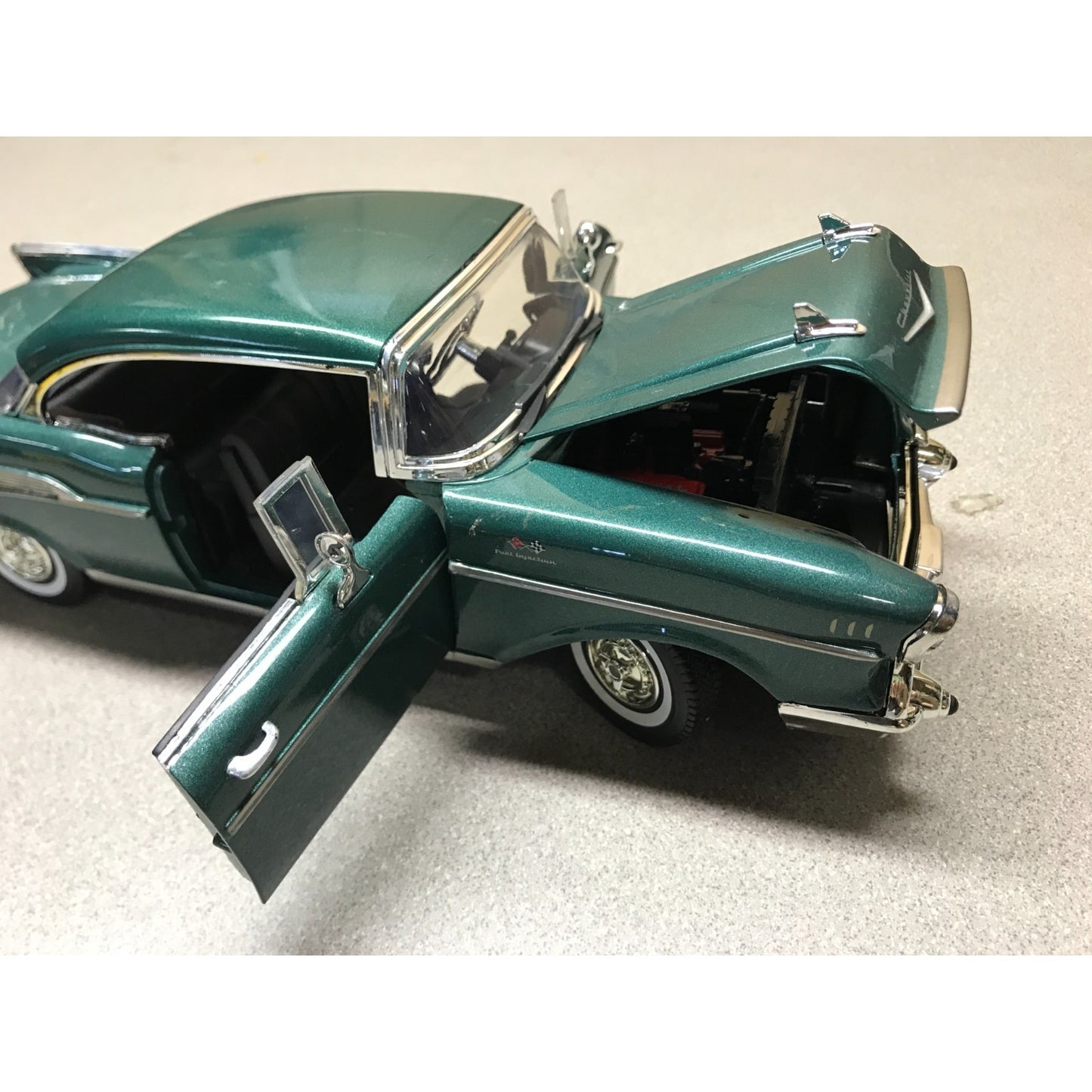 1957 Chevy Bel Air Hardtop Green Die Cast 1:18 Scale - Motor Max No. 73175 passenger side view with hood and door open