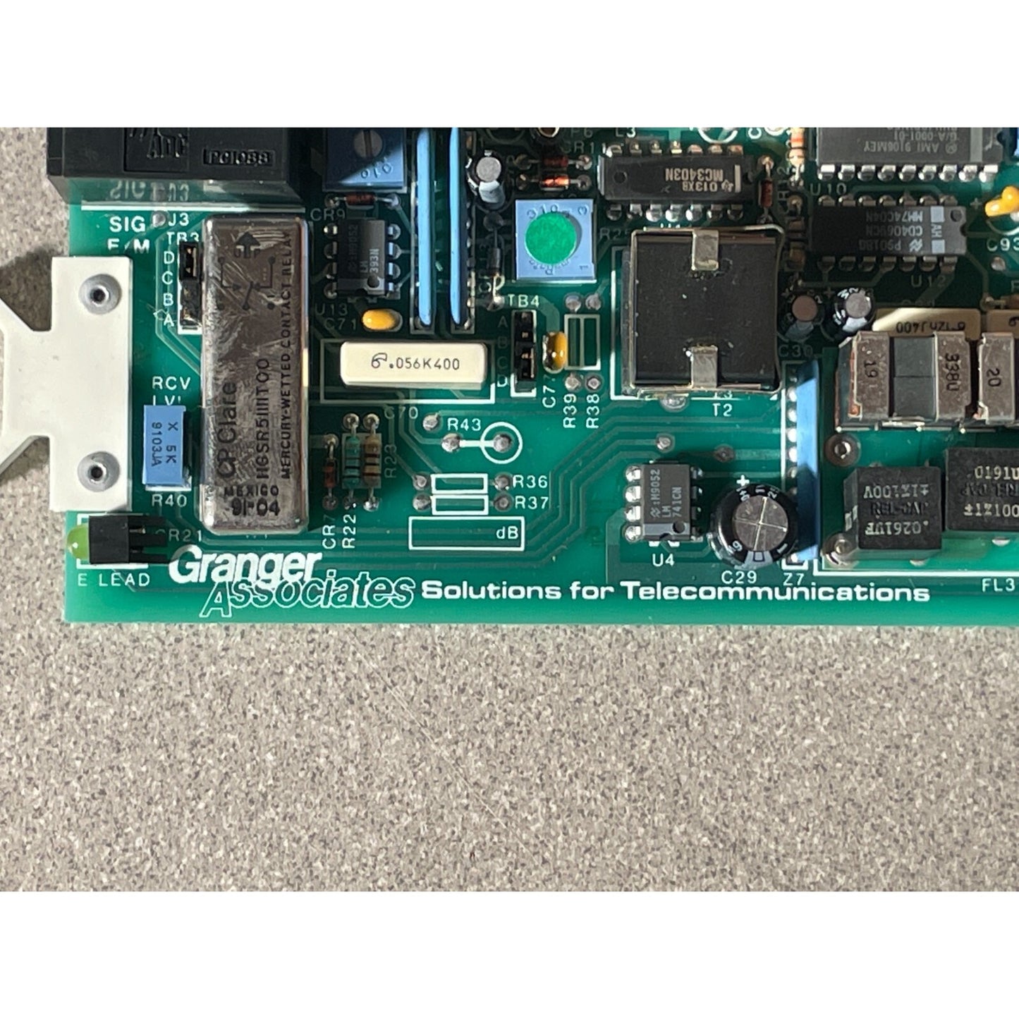 GRANGER ASSOCIATES DTL-7300 CHANNEL MODEM MODEL 4 ASSY 065-2795-II MODEL 4 manufacturer stamp closeup