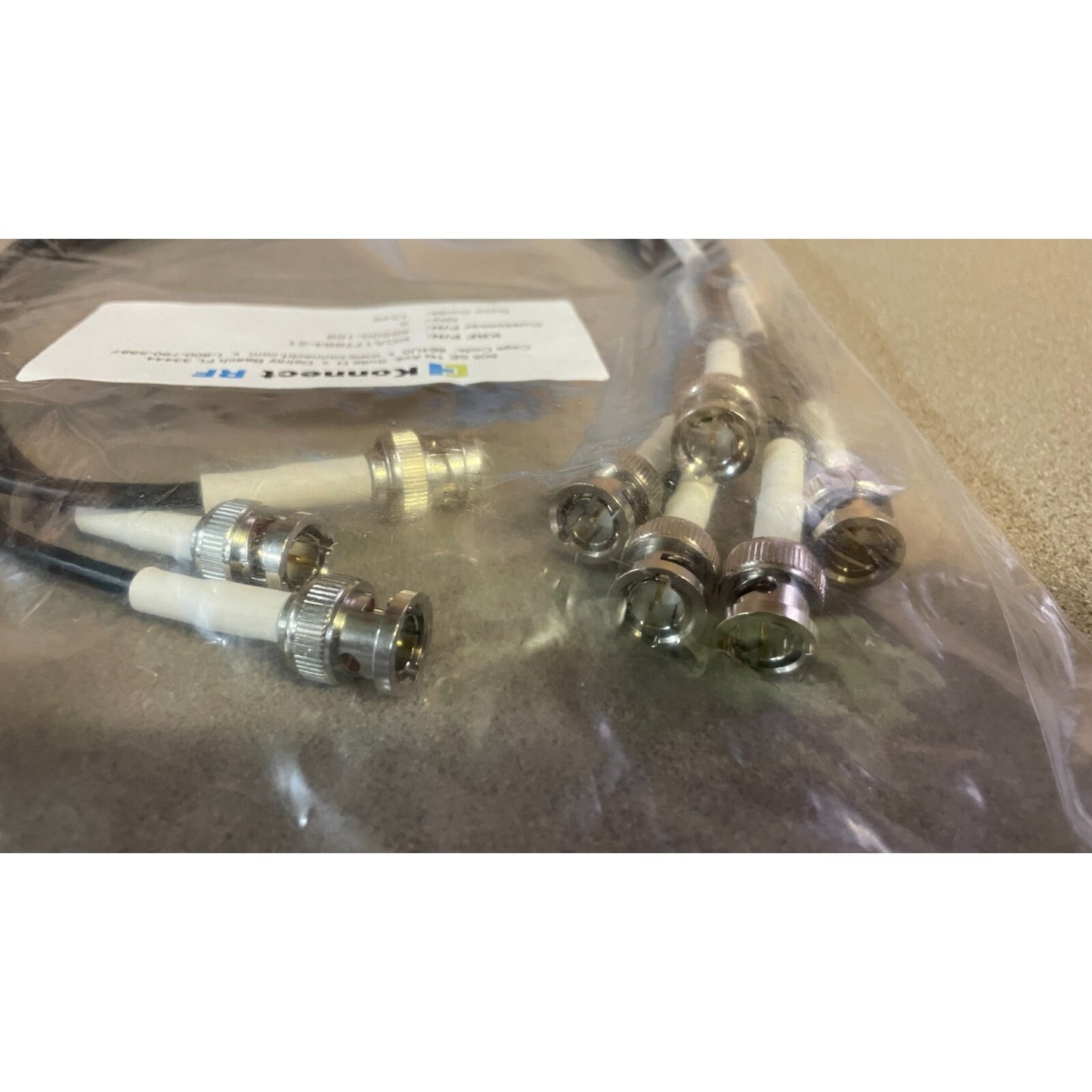 Konnect RF KCA177694-21, Lot of 5, BNC Male to BNC Male connectors closeup of connectors in plastic bag
