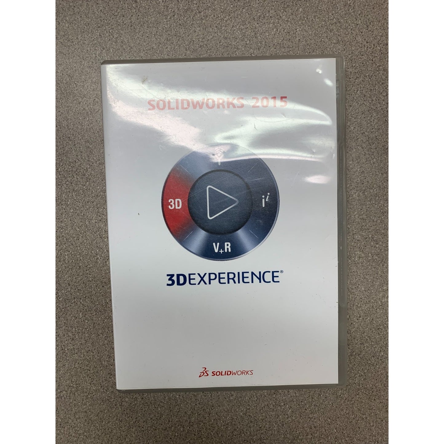 SolidWorks 2015 3DExperience software package on a gray surface
