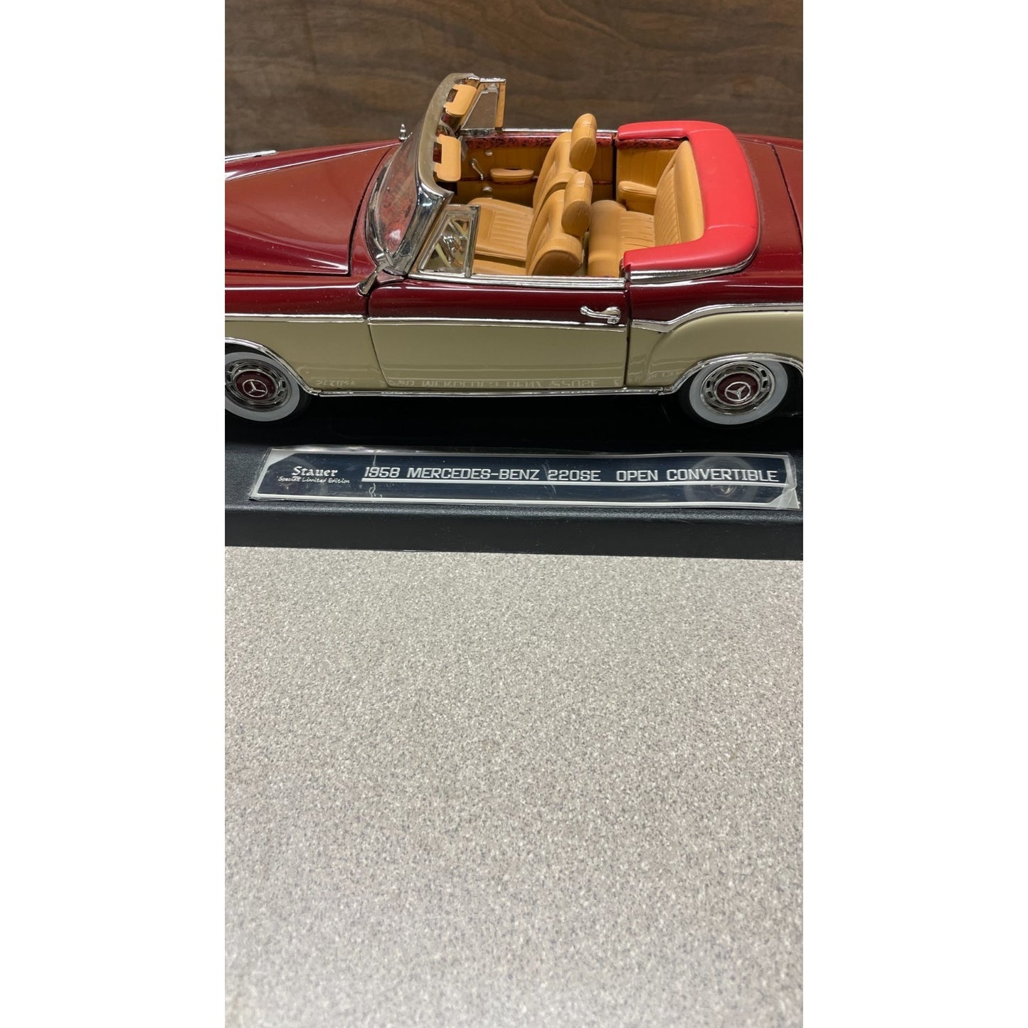 Stauer 1958 Mercedes-Benz 220SE Open Convertible Die Cast, Scale: 1/18 closeup of drivers side view with special edition label on display platform