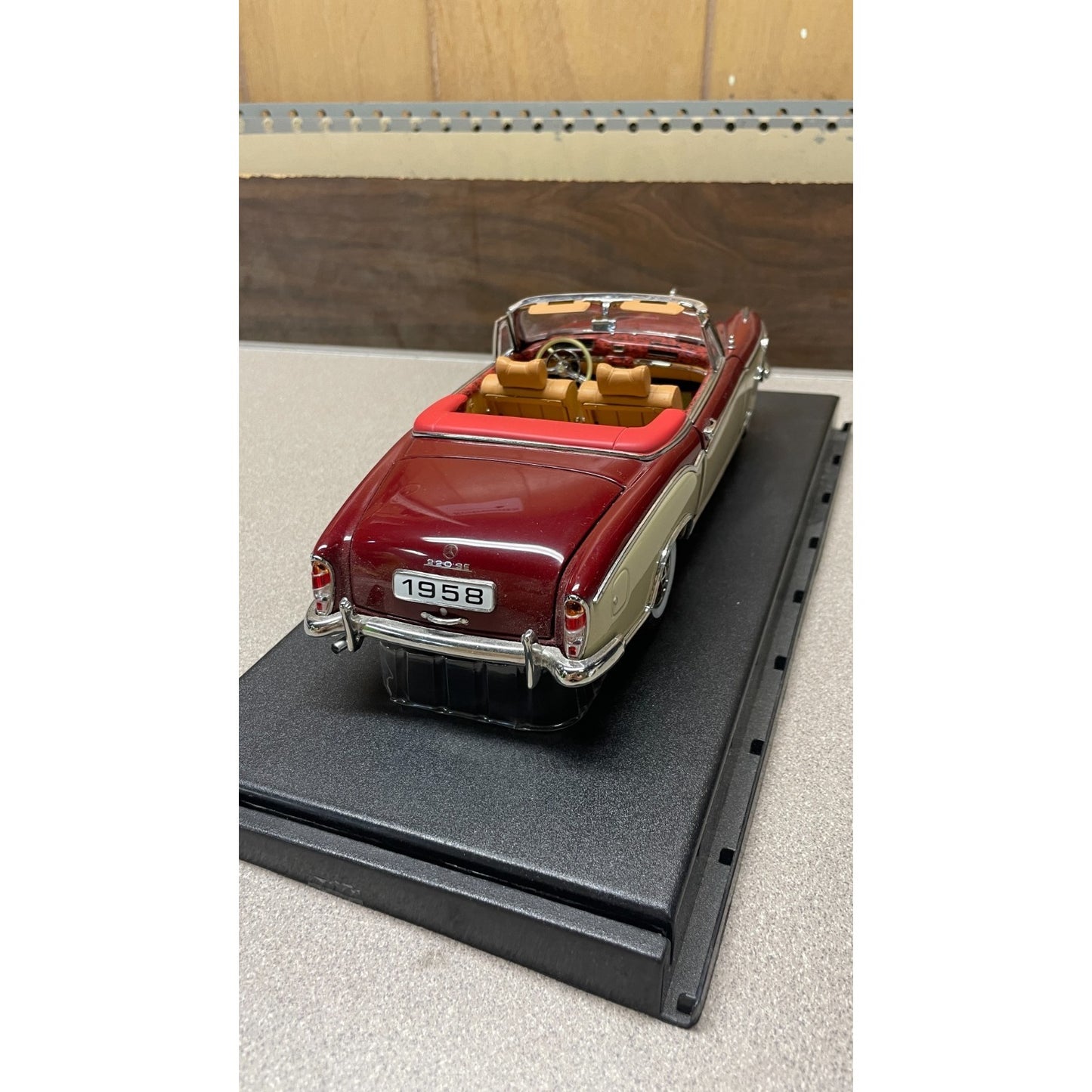 Stauer 1958 Mercedes-Benz 220SE Open Convertible Die Cast, Scale: 1/18 back end/trunk view on display platform