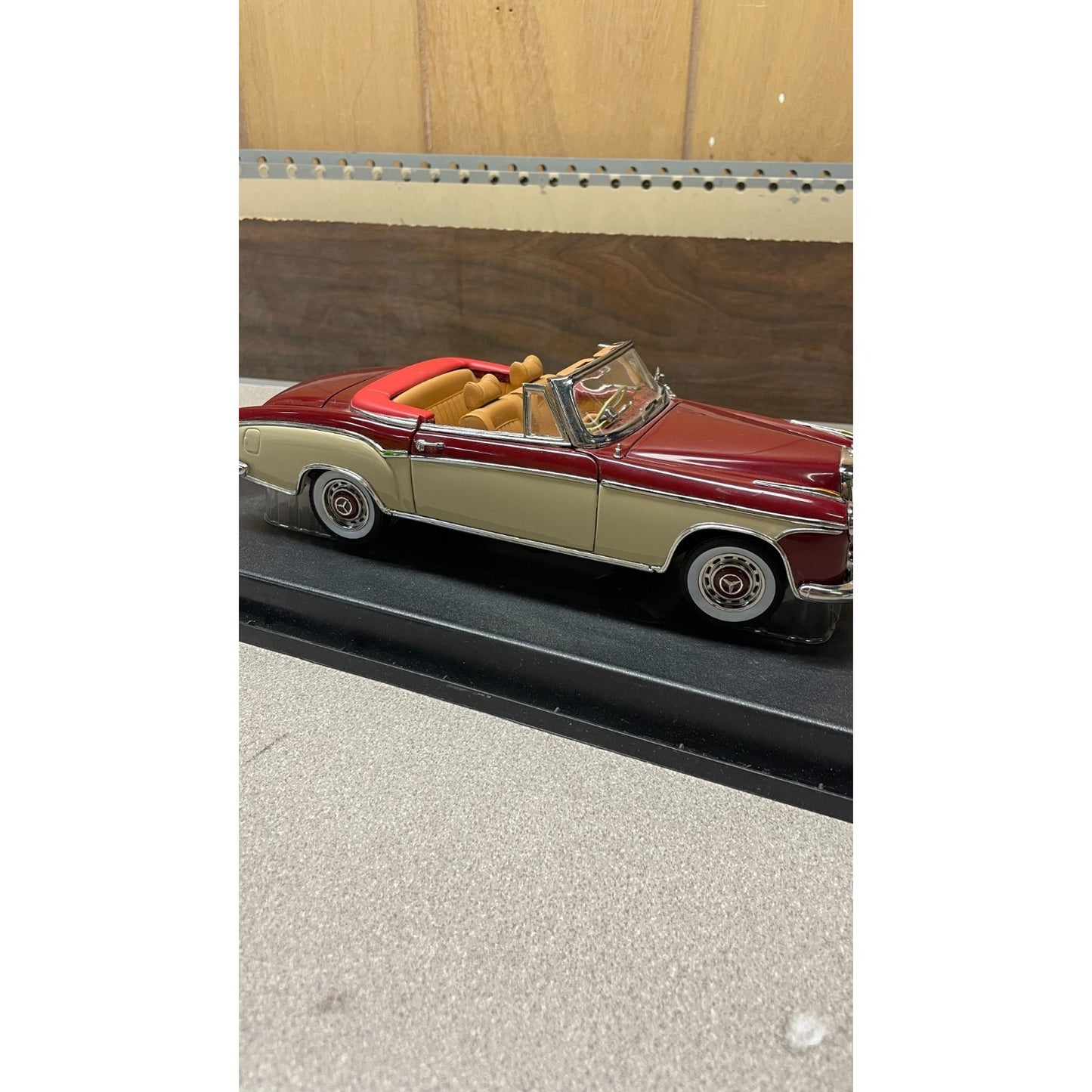 Stauer 1958 Mercedes-Benz 220SE Open Convertible Die Cast, Scale: 1/18 passenger side view on display platform