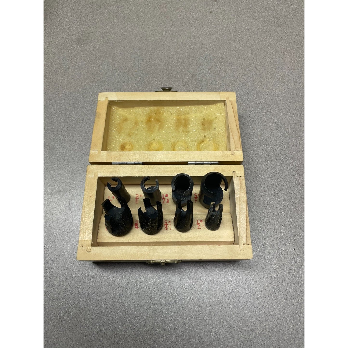 8 Piece Wood Plug Cutter Set 1/4" - 1/2" In Wooden Case top view of cutters in wooden case