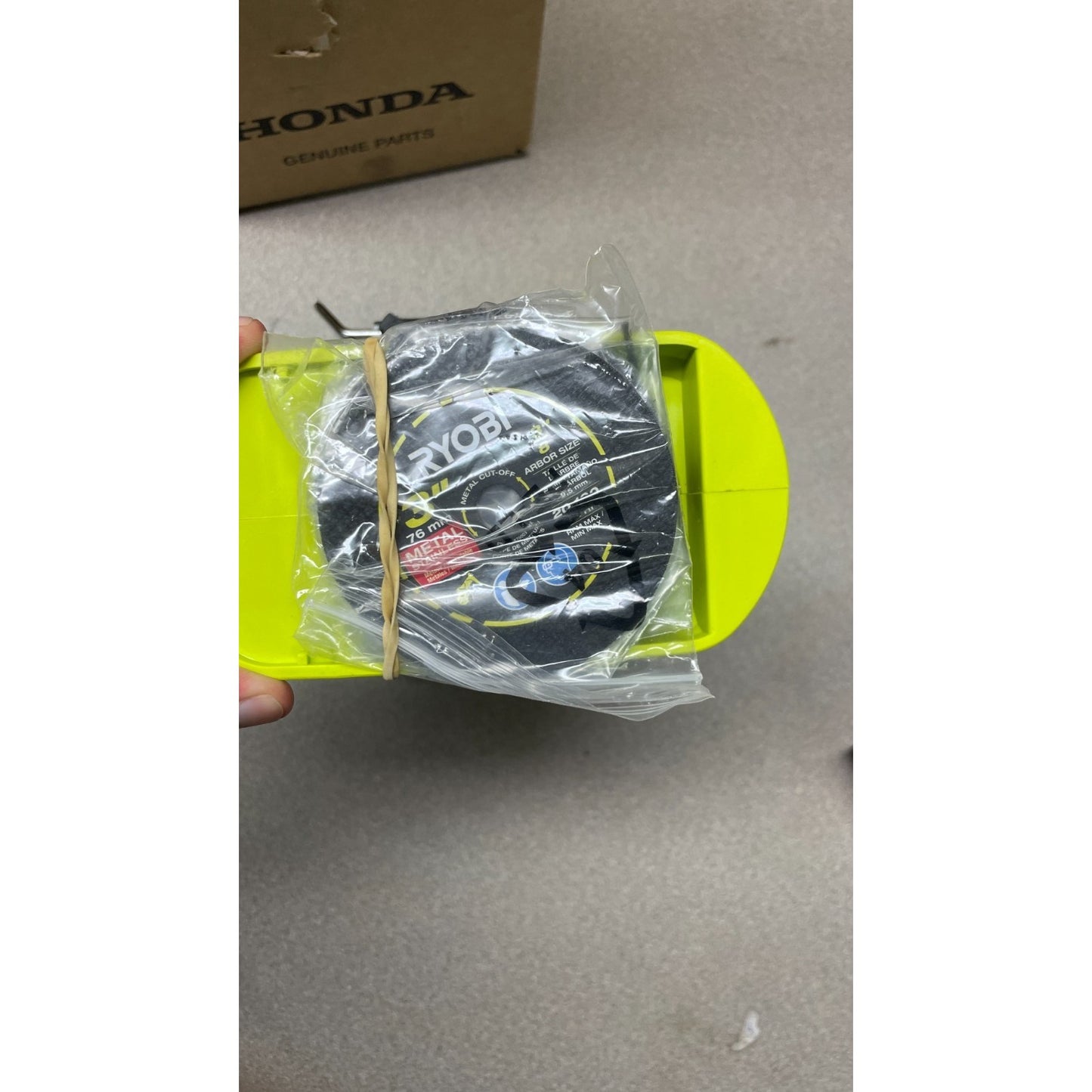 Ryobi PSBCS02 ONE+ HP Brushless Cut-Off-Saw extra blades in plastic bag attached to bottom of saw