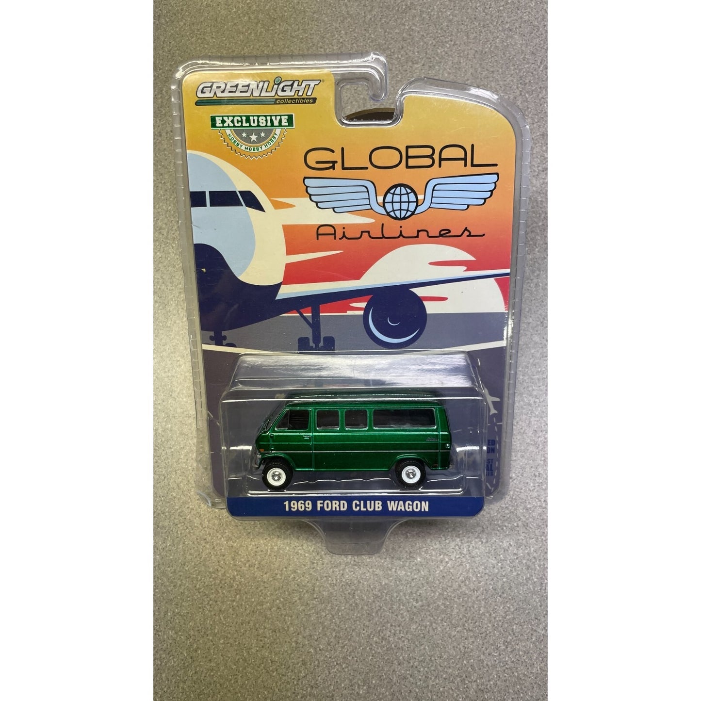 Greenlight 1969 Ford Club Wagon 1:64 front of package displaying car