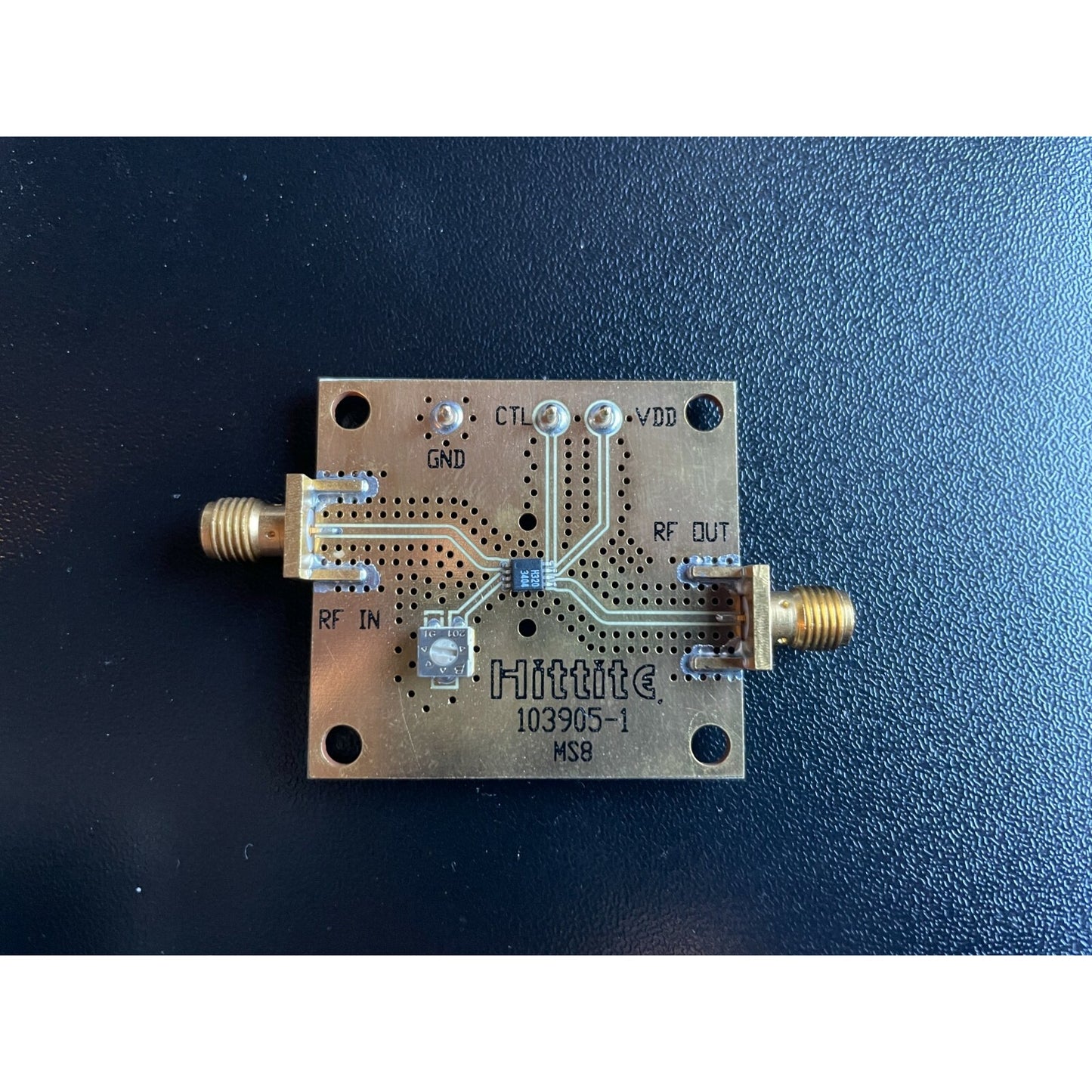 Hittite microwave component on a dark blue background