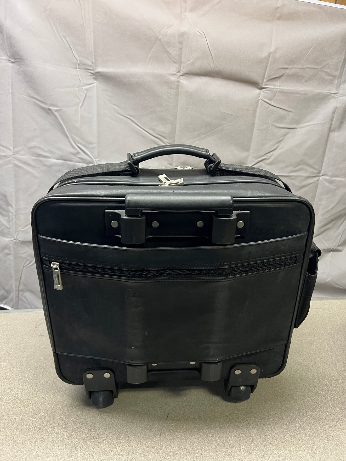Black U.S. Luggage New York Leather Travel Bag - handle and wheels