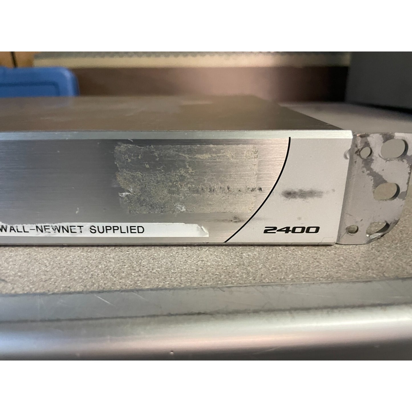 SonicWALL NSA 2400 Network Security Appliance Firewall model closeup 2400 bottom of bracket bent slightly