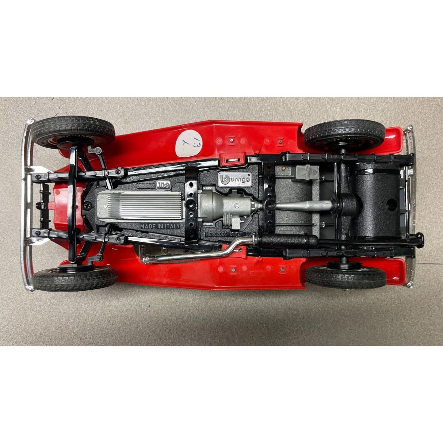 Burago 1936 Mercedes Benz 500k Roadster Red Die Cast, Scale 1:20, 3020, Made In Italy undercarriage view