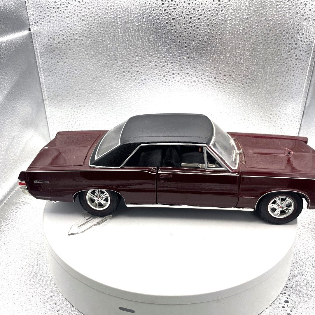 Maisto 1965 Pontiac GTO Special Edition Maroon Die Cast, Scale: 1/18 passenger side view