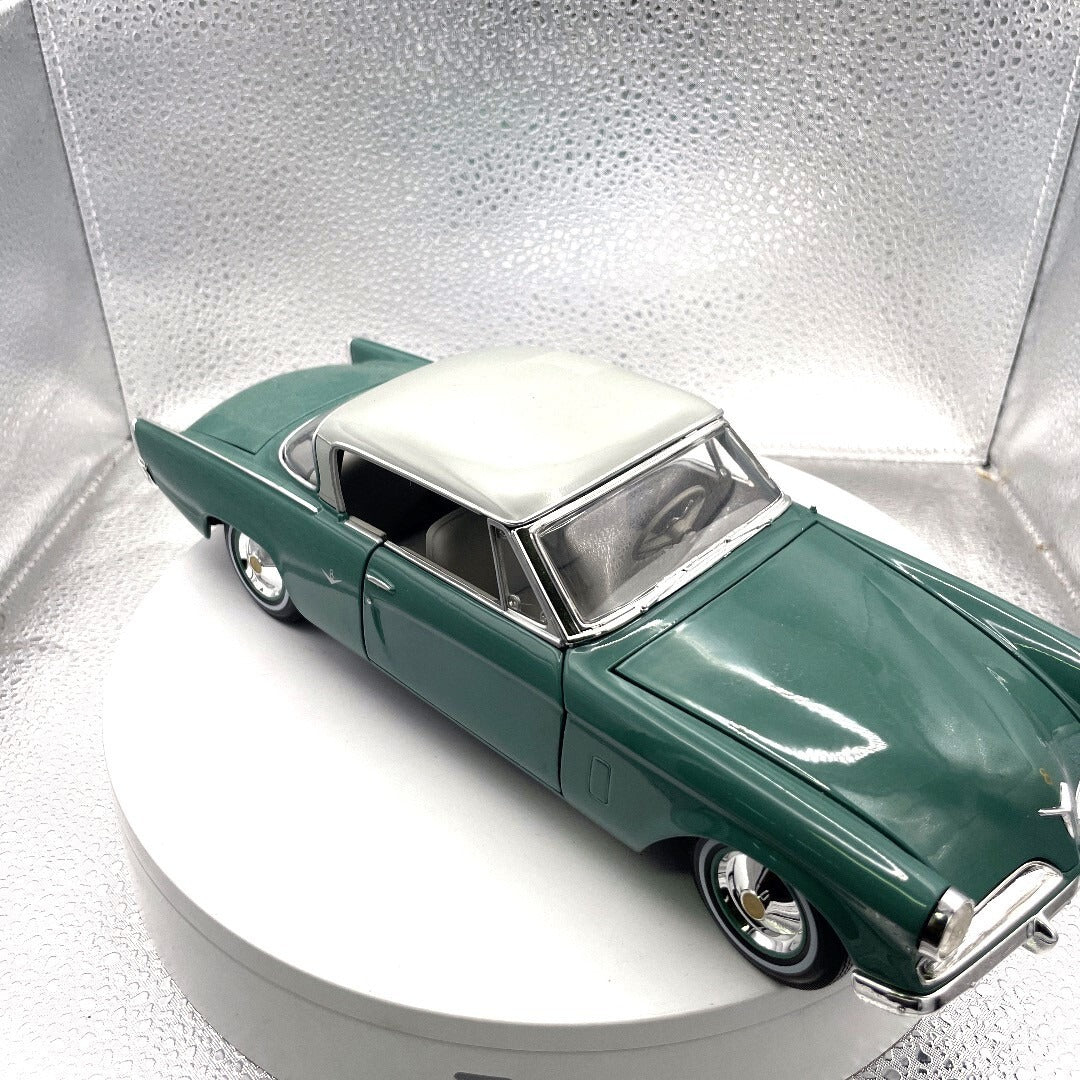 Miasto 1953 Studebaker Starliner Teal Die Cast, Scale: 1/18 11451 front/passenger side view