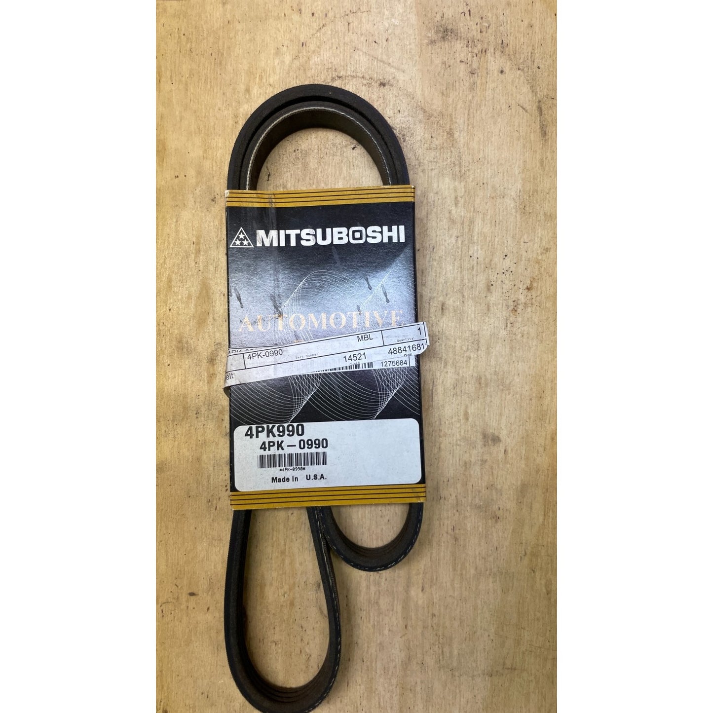 Mitsuboshi 4PK990 Automotive Belt front view of belt in packaging