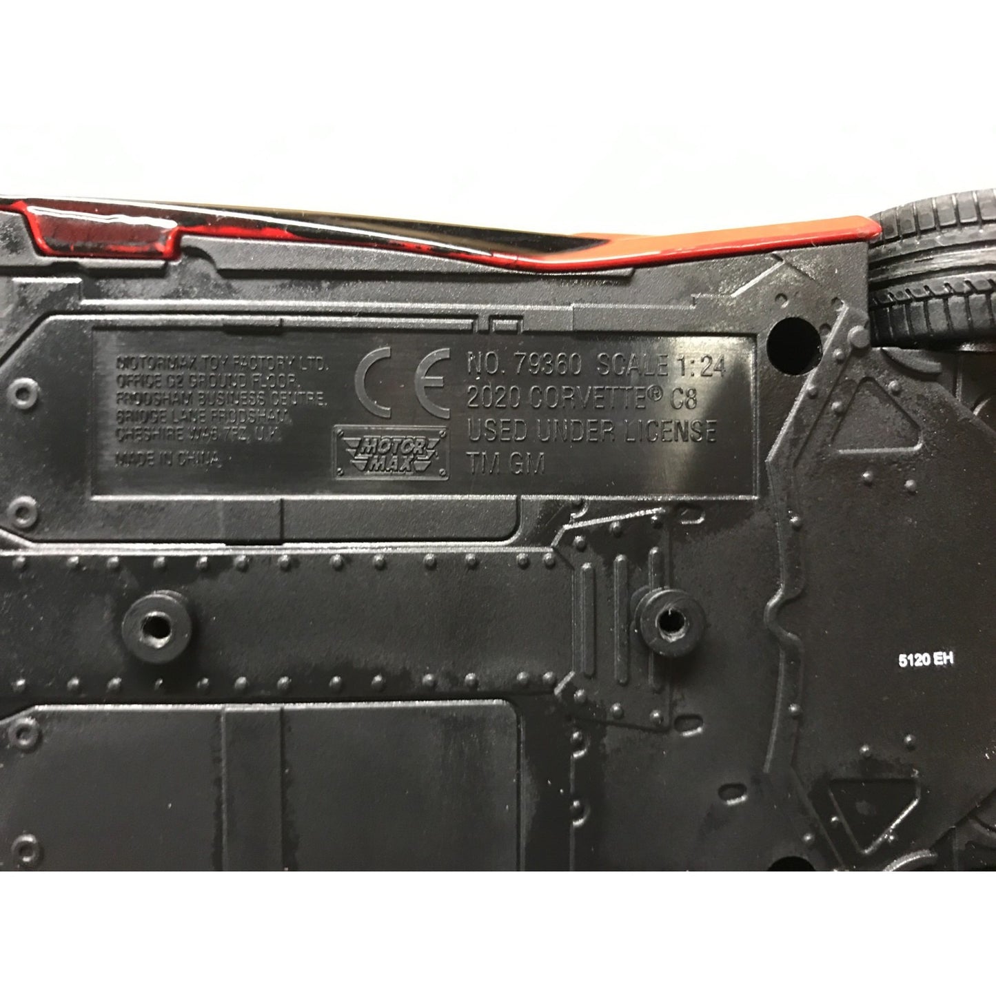 Close-up of a model car's back with branding and specifications.