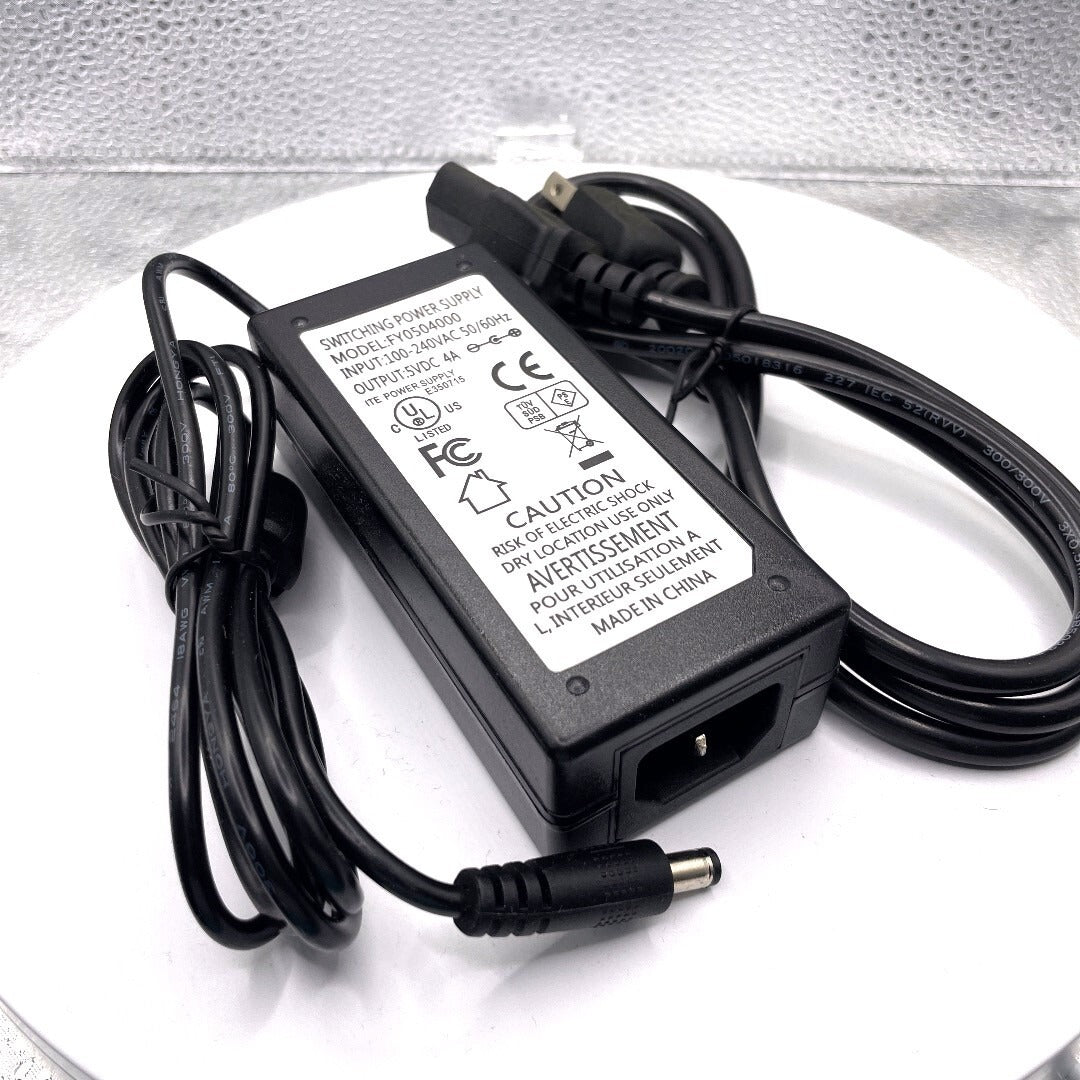 Switching Power Supply Model FY0504000 100-240Vac in, 5Vdc out label view with cables