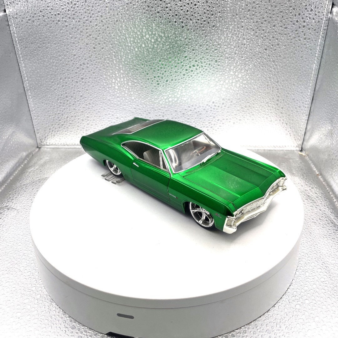 Jada Toys 1967 Chevrolet Impala SS Green Die Cast Dub City OldSkool, Scale: 1/24, No. 50310-9 passenger side/front end view