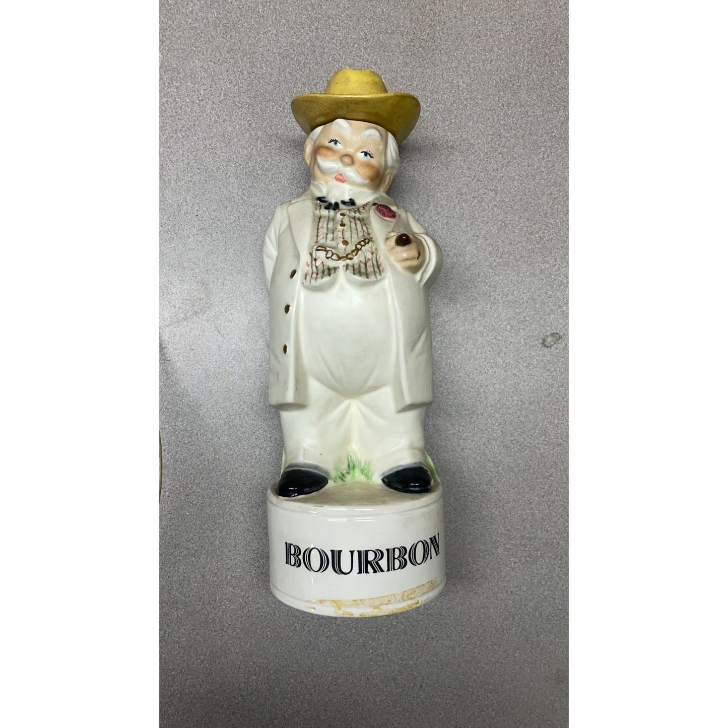 Vintage Alberta's Ceramic Hand Painted Bourbon Decanter front view of man in a vintage suit with top hat and the word Bourbon at the base