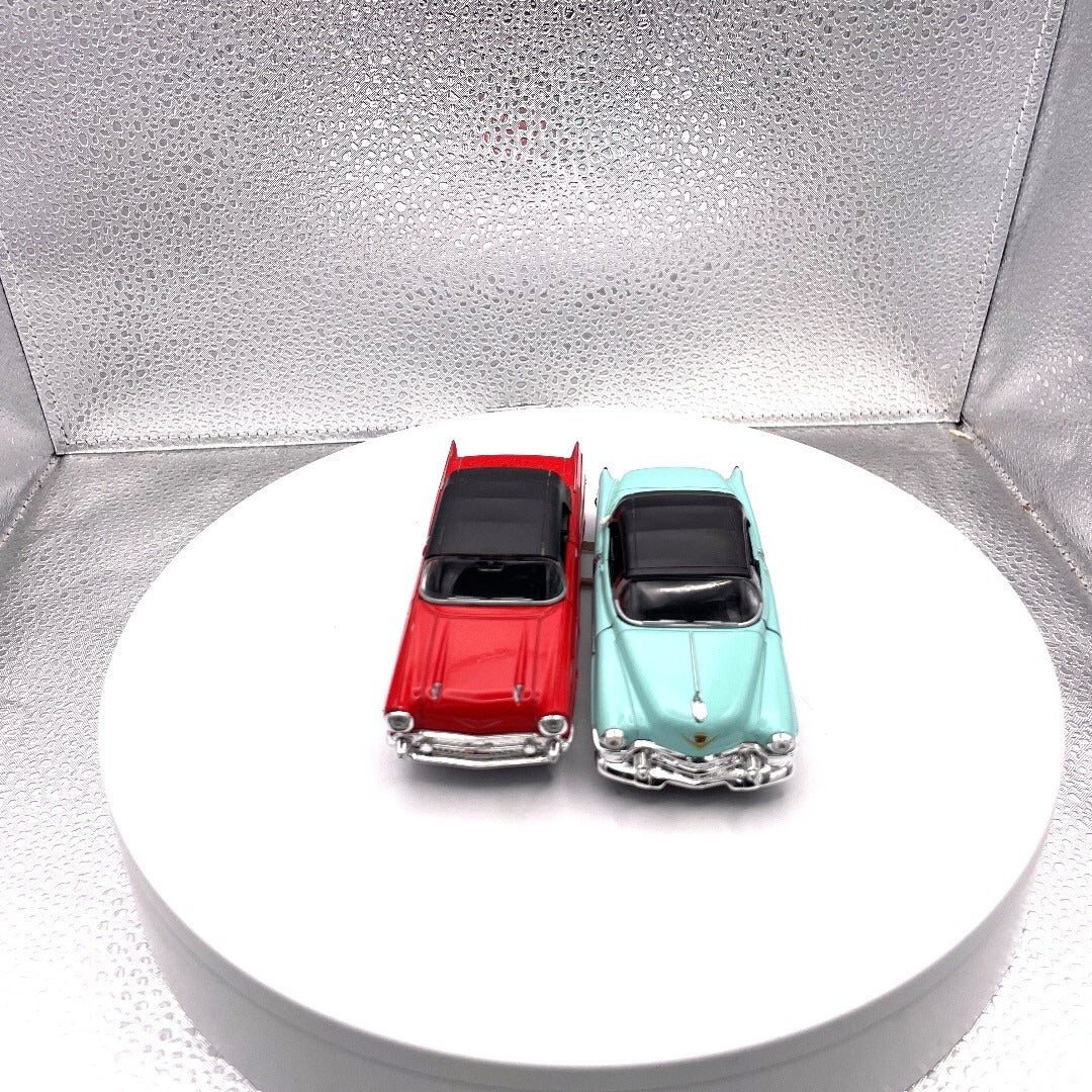 Welly Wind Up Car Lot of 2, 1857 Chevrolet Bel Air Red, 1953 Cadillac Eldorado Teal front end view