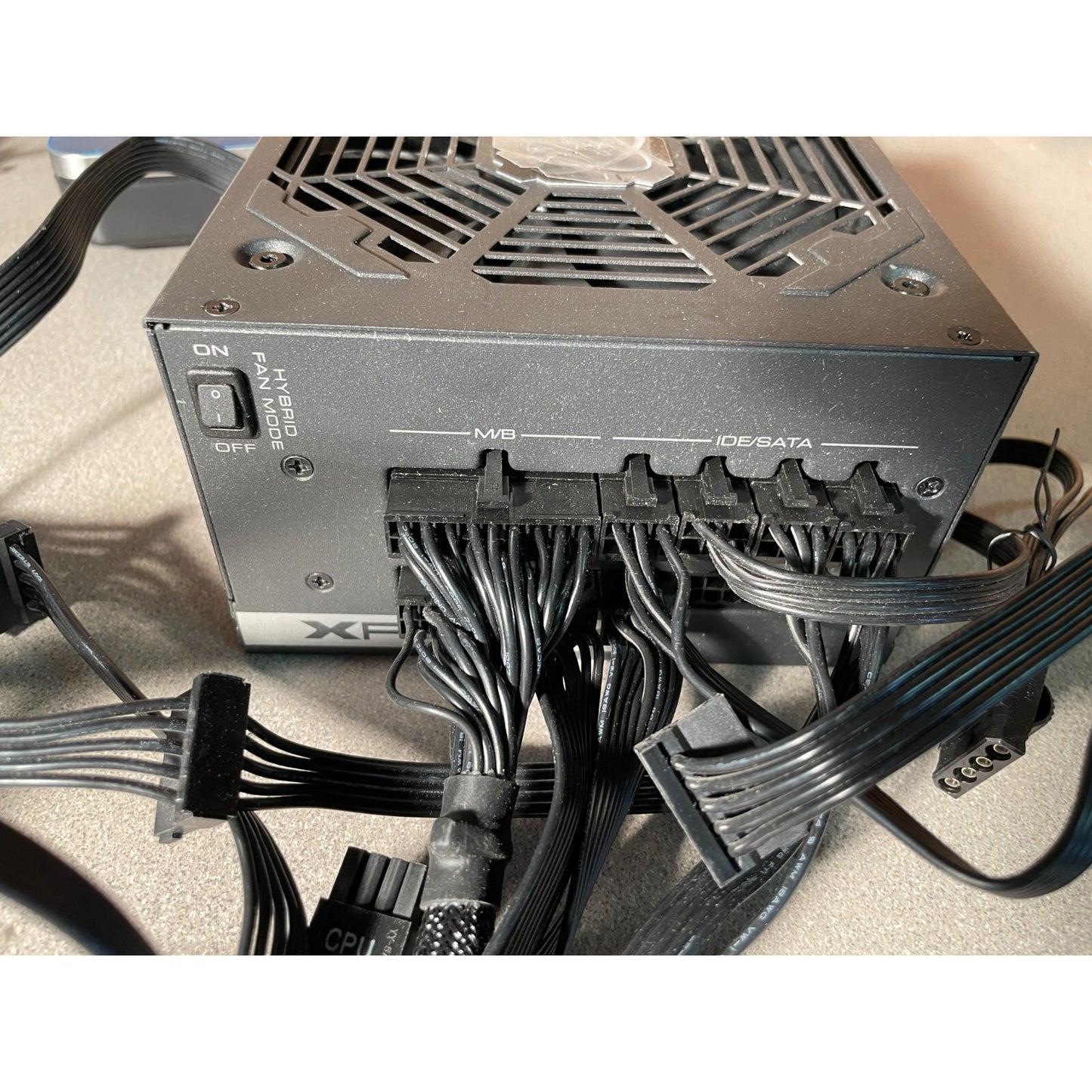 XFX XTR 550 Power Supply Model XPS-550W-BEF side view with cable connections, power switch