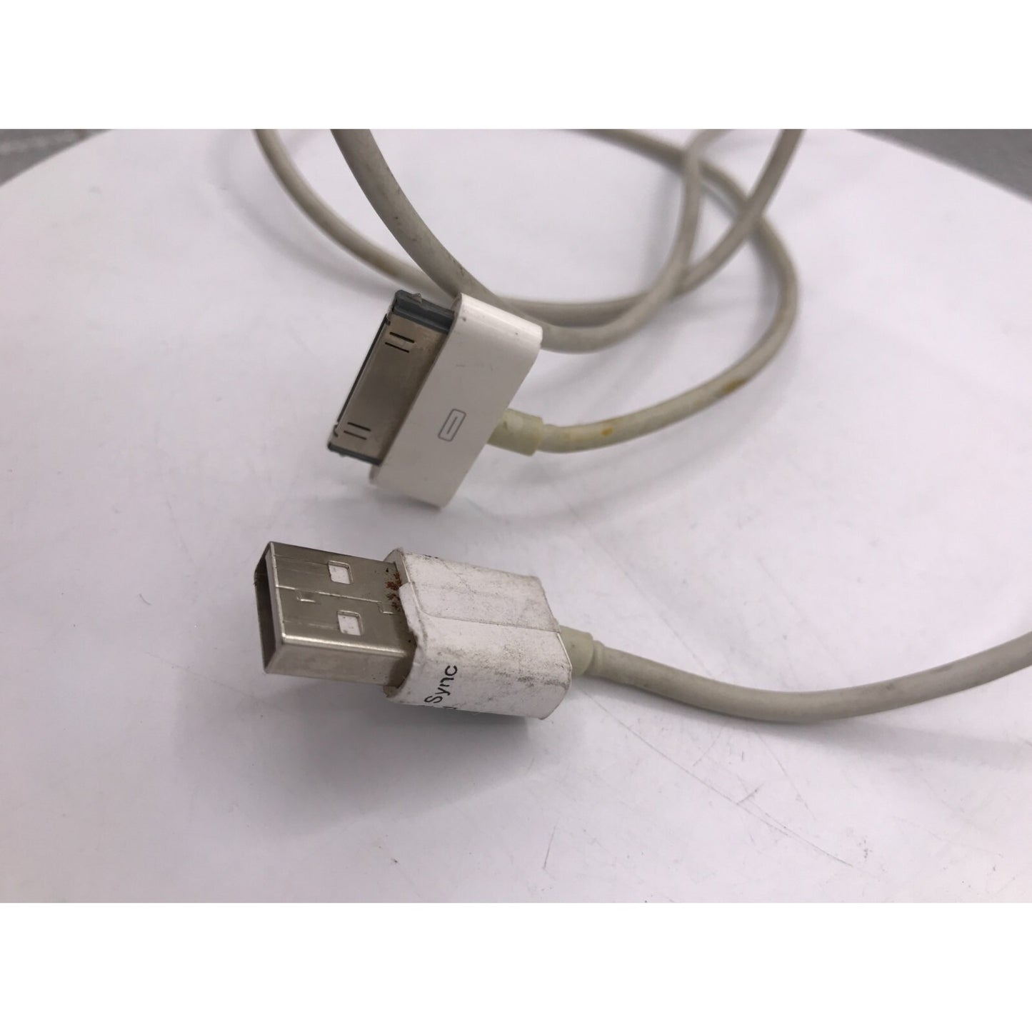 Used iPad 2 Model A1395 16GB with charging power cable cable close up