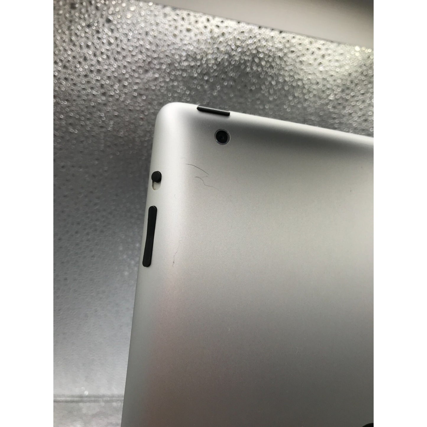 Used iPad 2 Model A1395 16GB with charging cable connections closeup