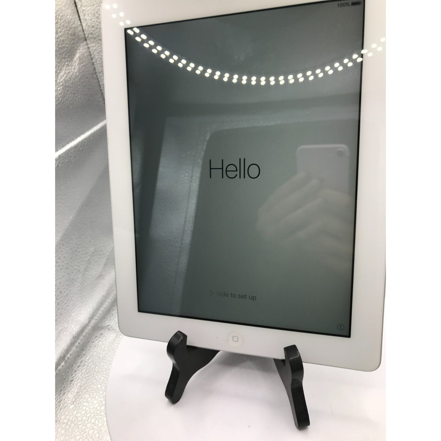 Used iPad 2 Model A1395 16GB with charging cable front view powered on