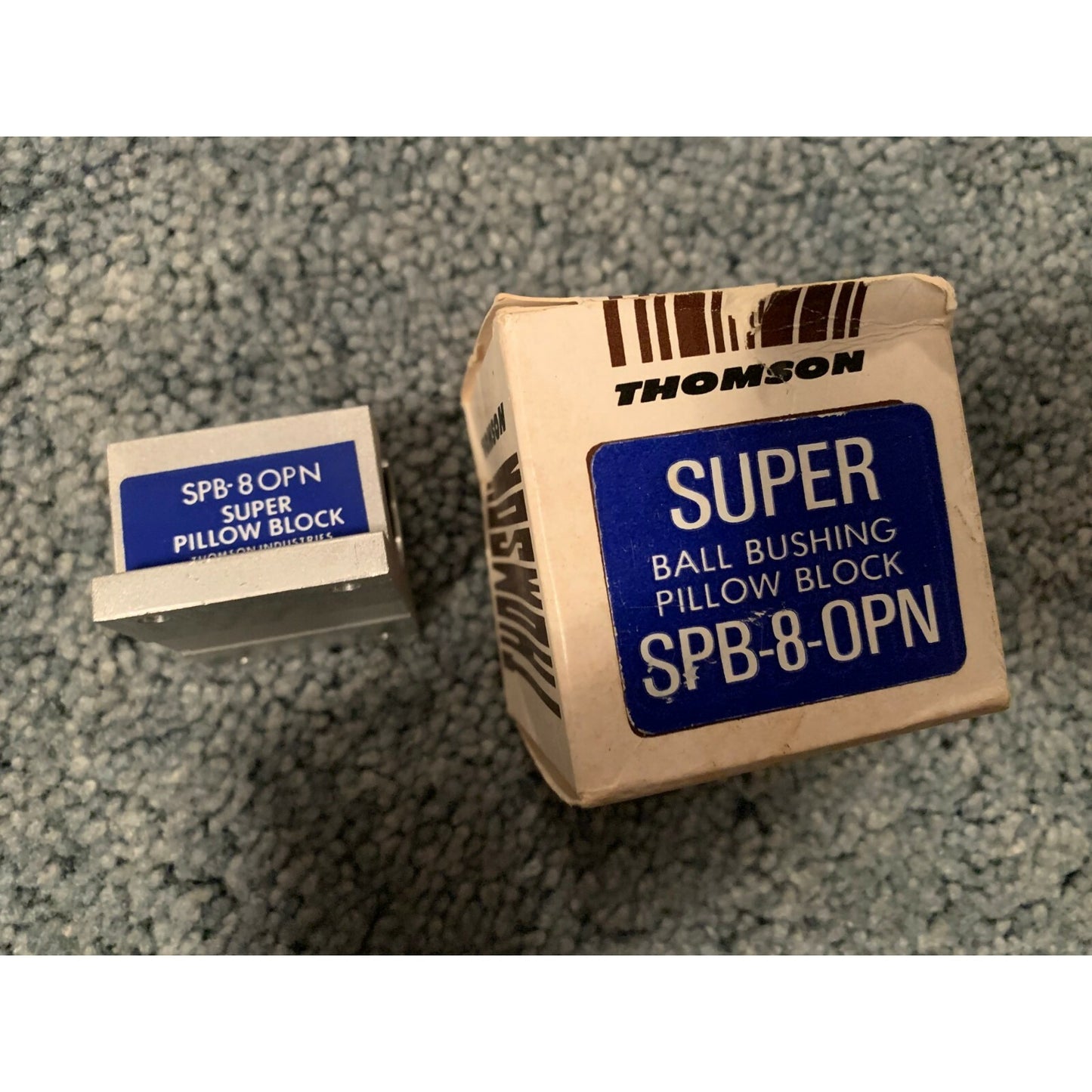 Thomson Industries SPB-8-OPN Super Ball Bushing Pillow Block side view of block with box
