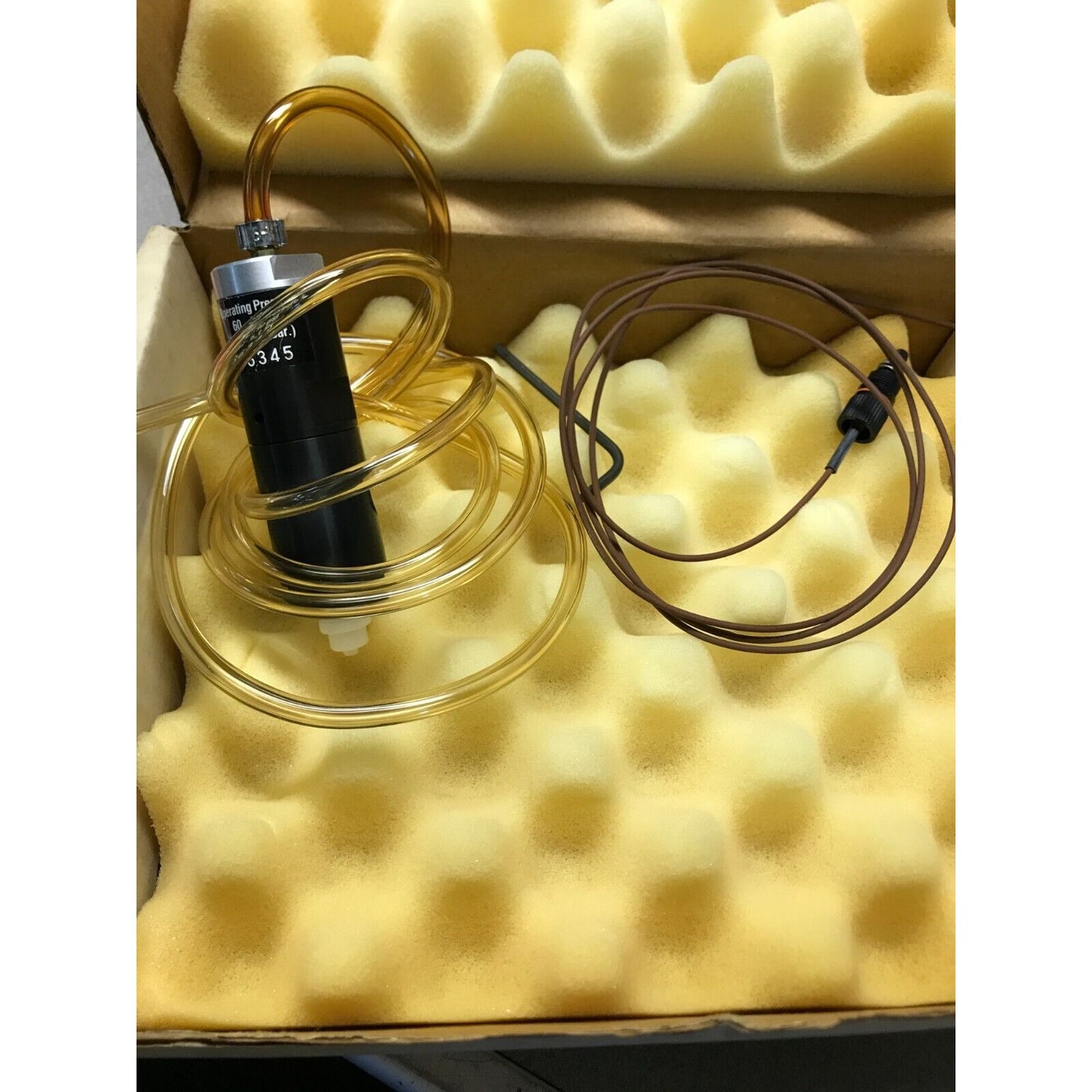 EFD Liquid Metering Valve 86345 hose and valve closeup in package