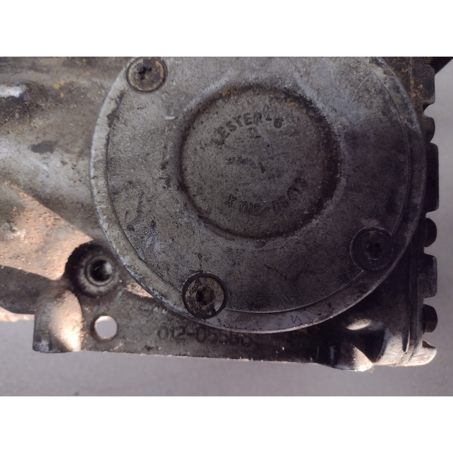 AC Compressor - Lester-6 012-05586 with bracket. bottom closeup