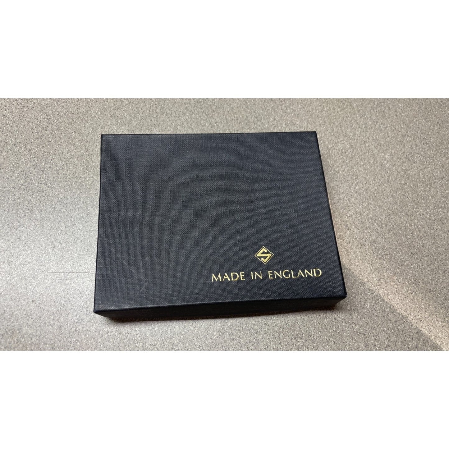 Stanley of England Brown Adelaide Lamb Leather Wallet front of box with logo and made in England stamp