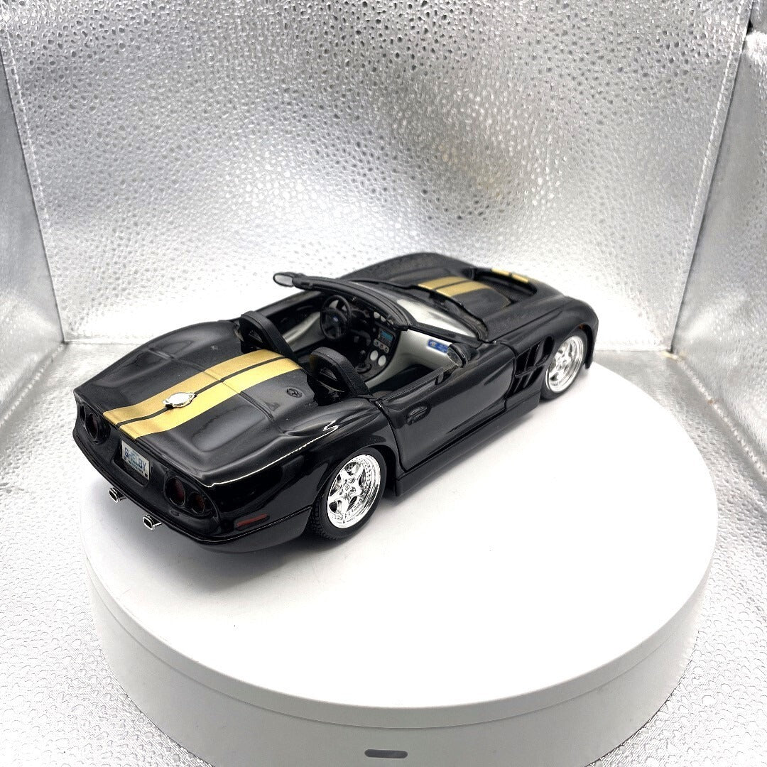 Maisto 1999 Shelby Series 1 Black and Gold Die Cast, 1/18 Scale rea/passenger side view
