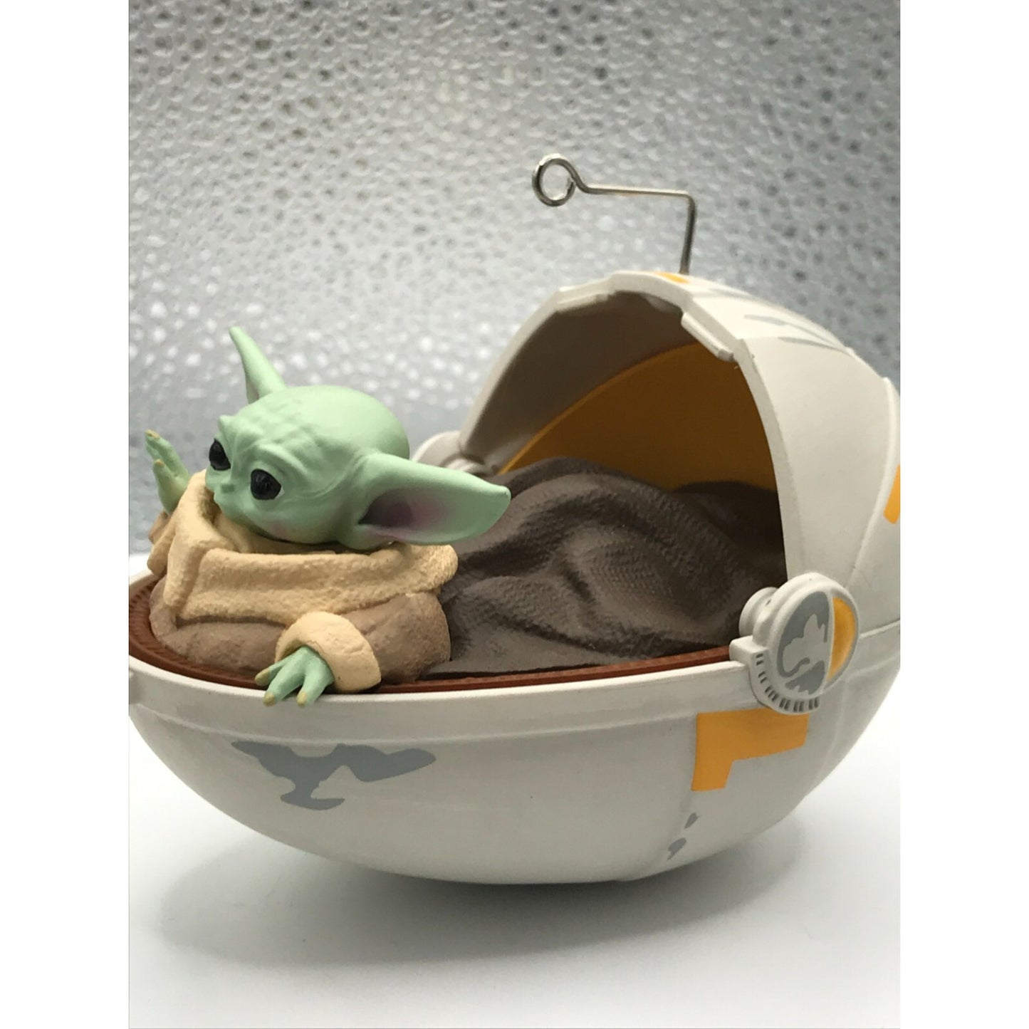2020 The Child Hallmark Keepsake Christmas Tree Ornament from Star Wars The Mandalorian
side view out of packaging