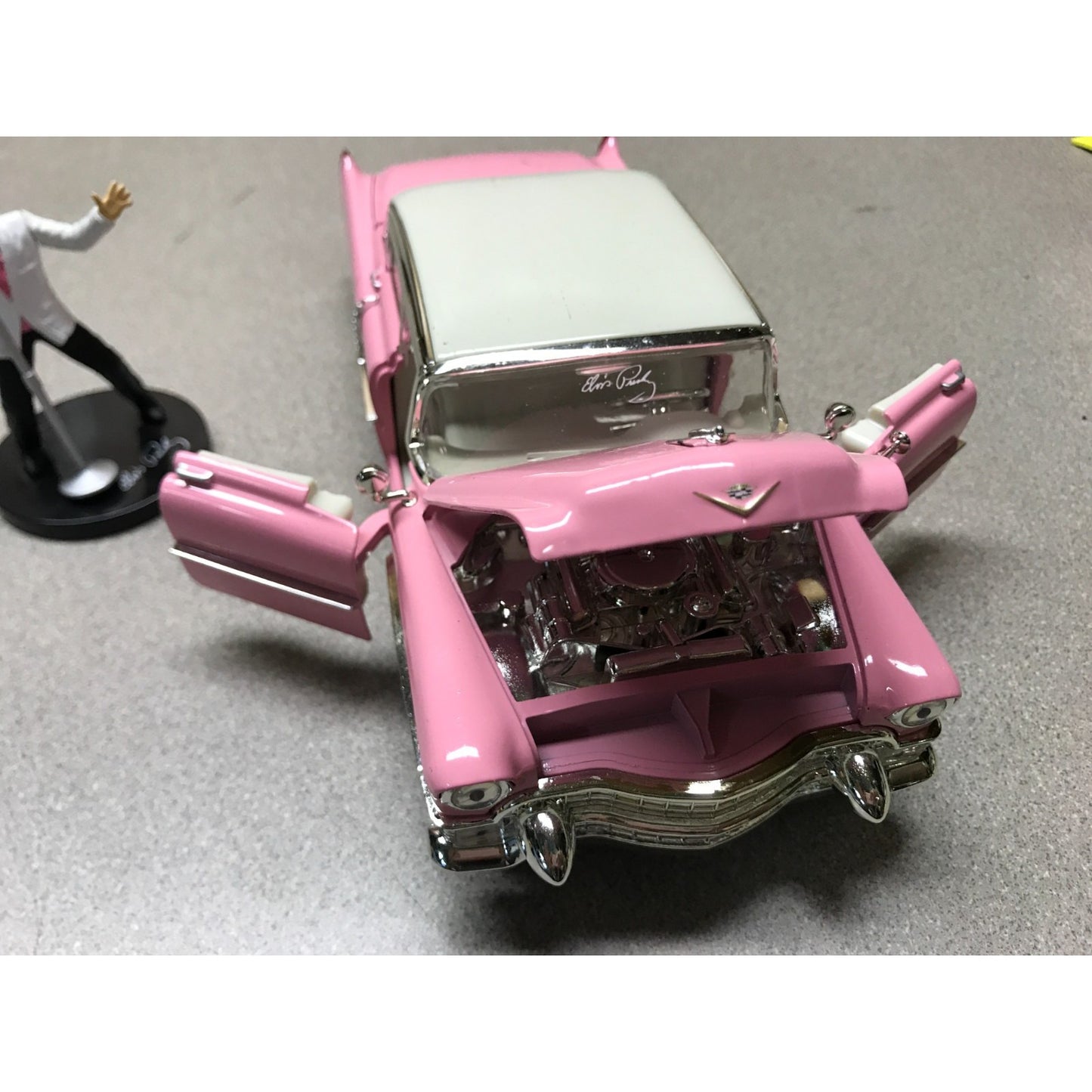 1955 Cadillac Fleetwood Elvis Presley Pink with Elvis Figurine - Jada Die Cast 1:24 Scale front end view hood and doors open