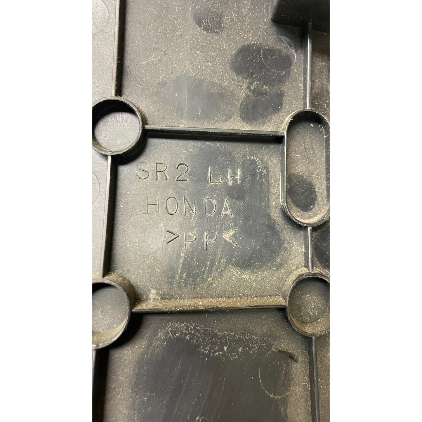 OEM Honda Civic Del Sol Left Under Dash Column Panel Cover Plate Trim SR2 LH closeup of part stamp on back of part