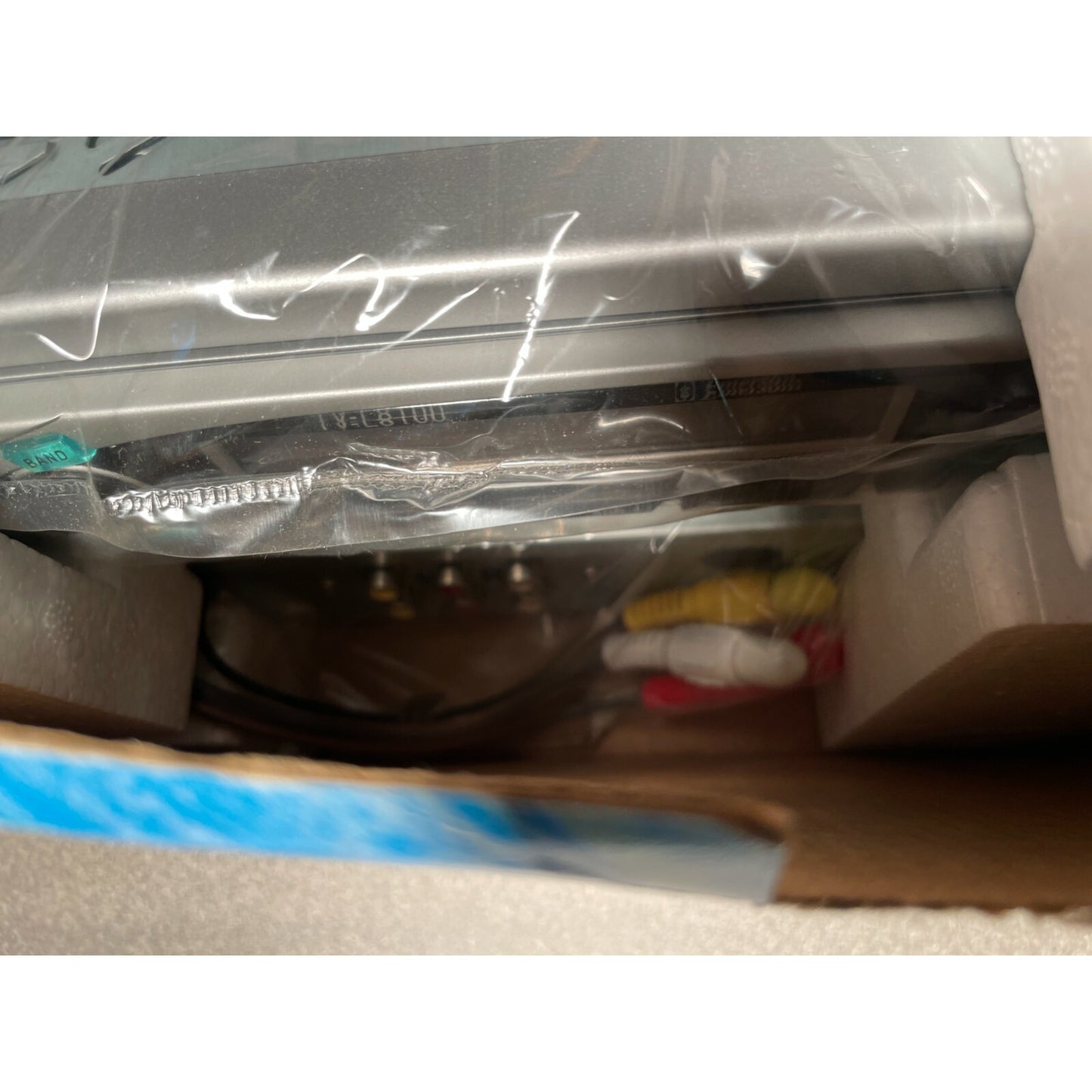 Emerson Mobile TV-L8100, 5in TFT LCD, In-Dash Flip Out TV closeup in packaging