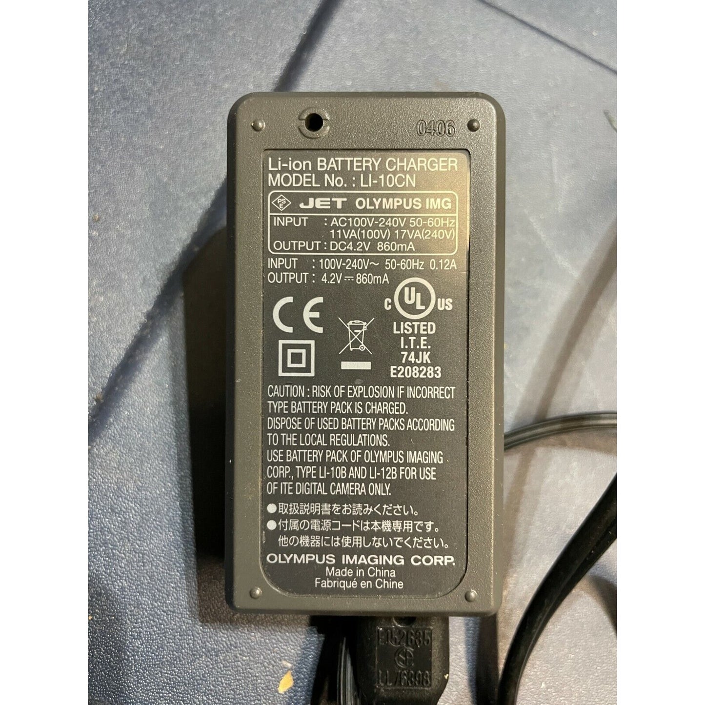 Olympus Li-ion Battery Charger LI-106 With Power Cord label