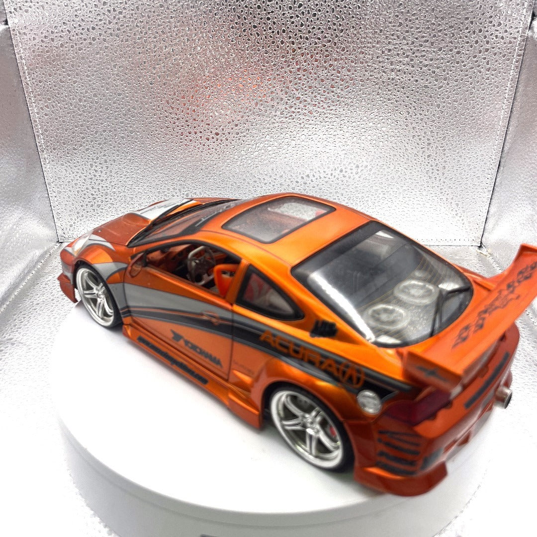 Muscle Machines 2002 Acura RSX Orange Die Cast, 1:18 Scale drivers side/back end view