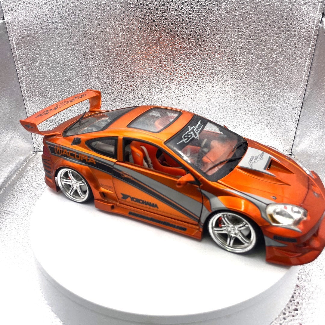 Muscle Machines 2002 Acura RSX Orange Die Cast, 1:18 Scale passenger/front end view