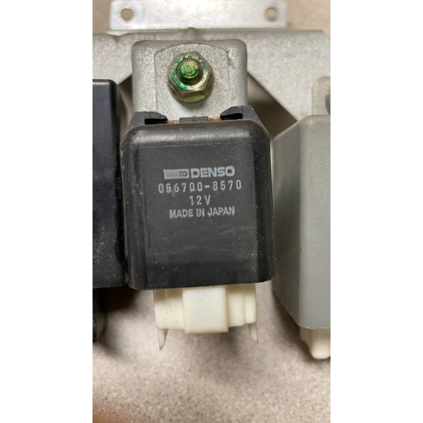 Denso relay with visible branding on a white background