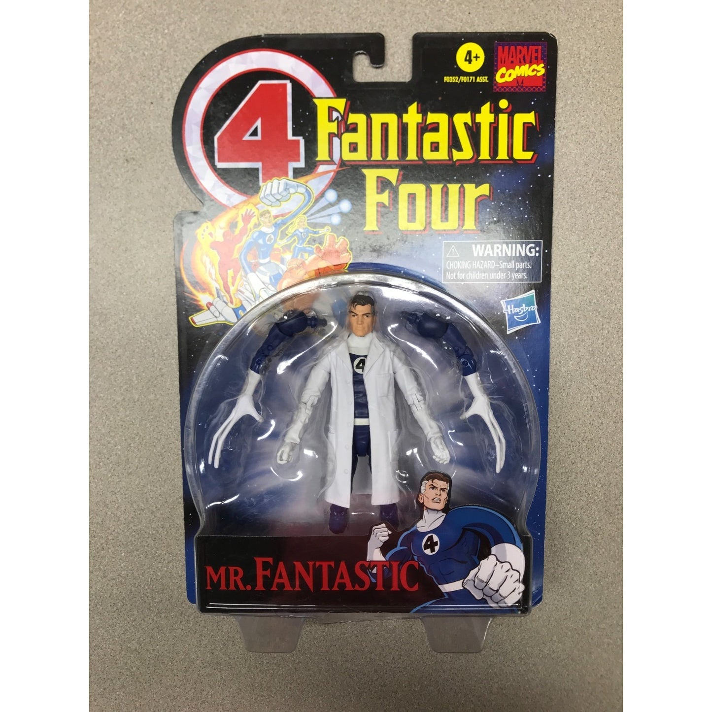 Hasbro Marvel Comics 4 Fantastic Four Mr. Fantastic action figure in original blister packaging, featuring a white lab coat and blue pants.