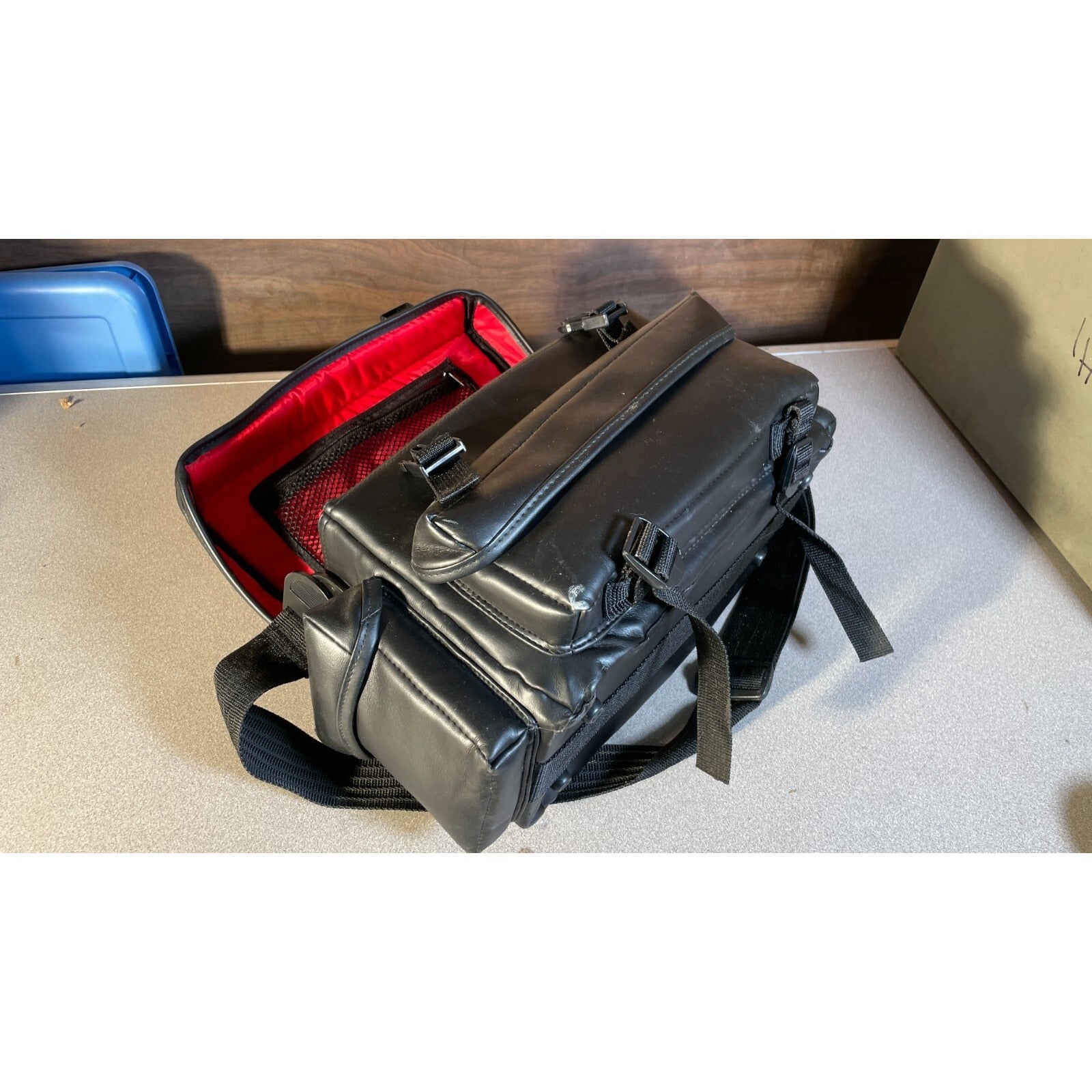 Classic Ambico Camera Bag side view with top of case open red interior
