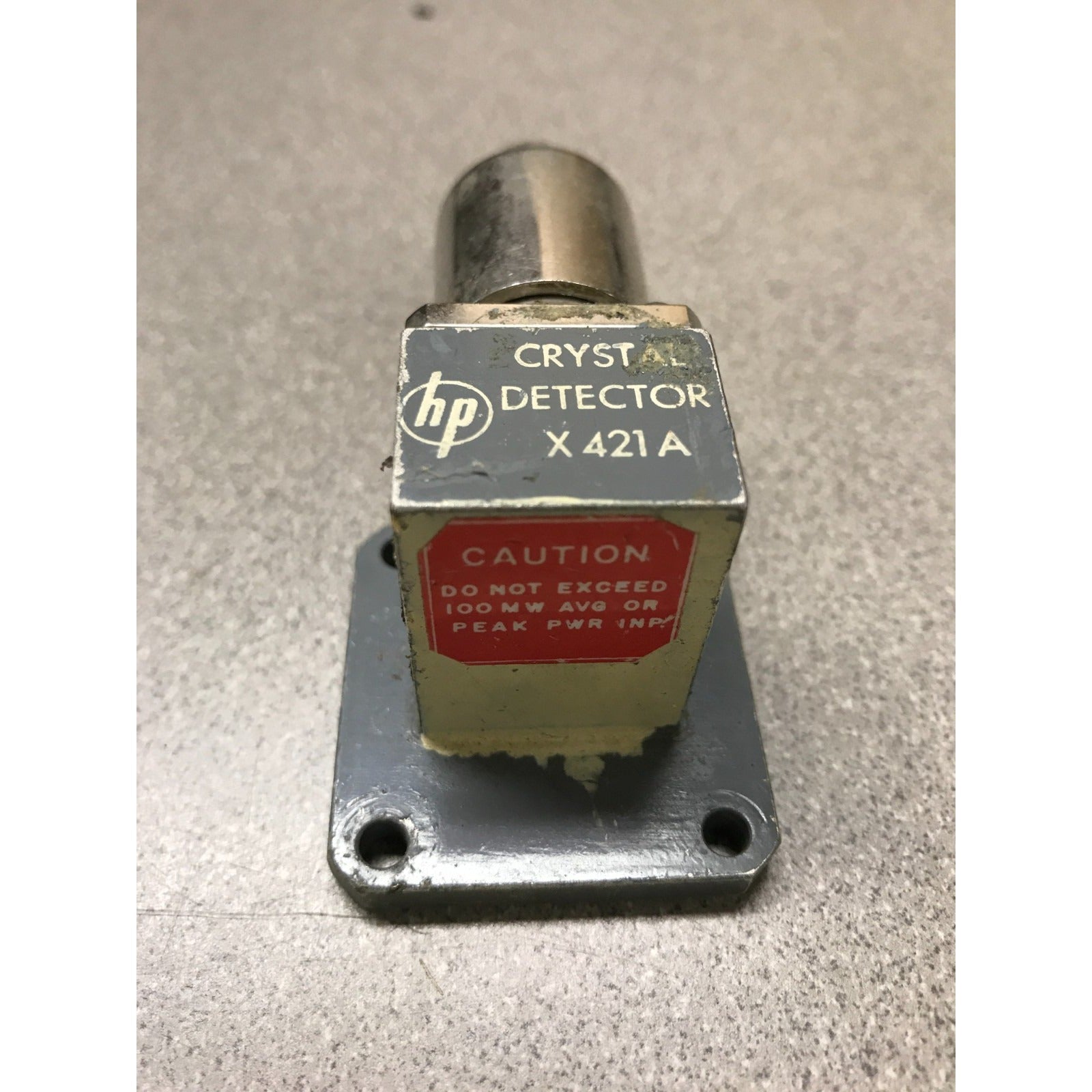 Crystal detector X421A with HP logo on a gray background