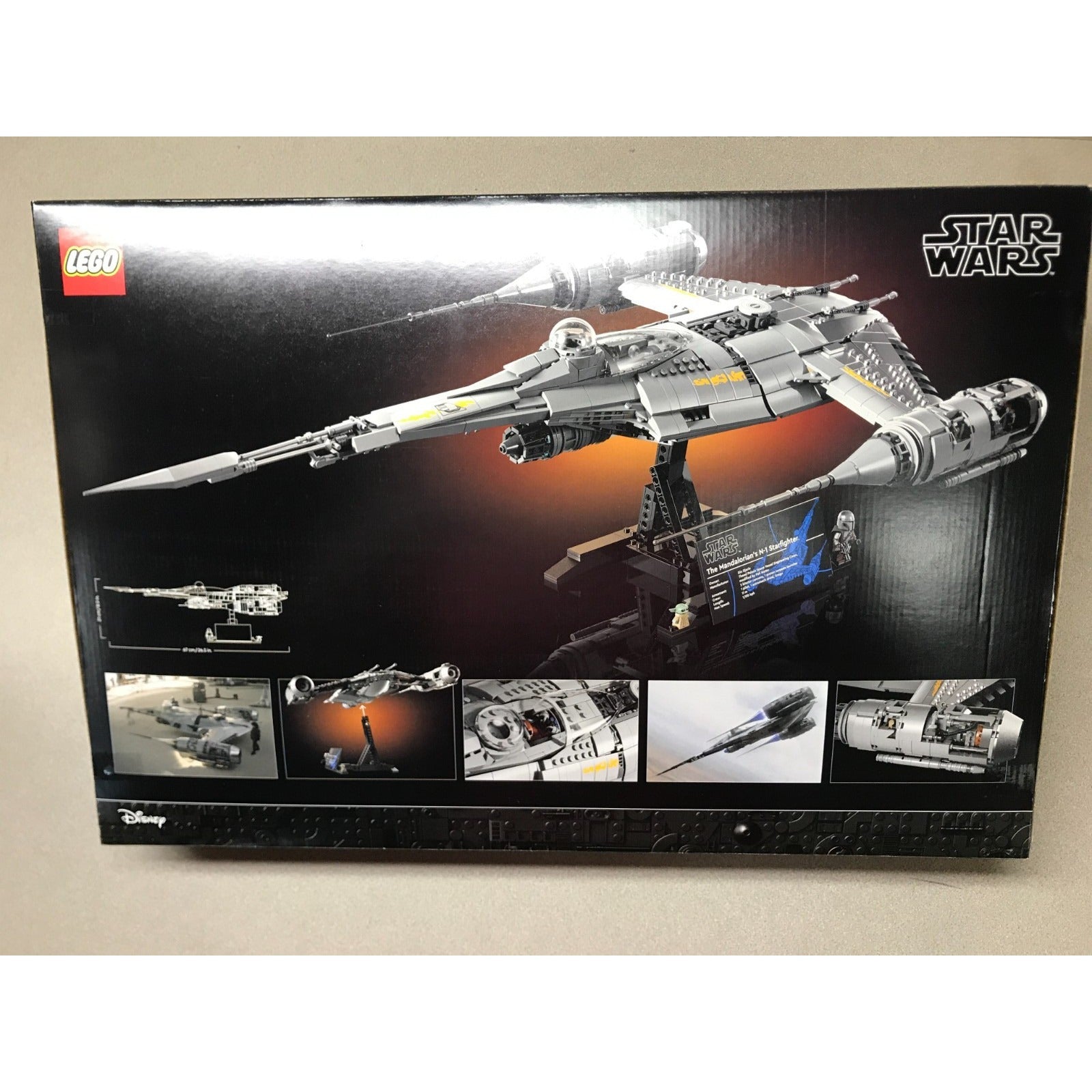LEGO Star Wars X-wing R&D display set box, showing the assembled model and various feature panels on a black background. Back of package