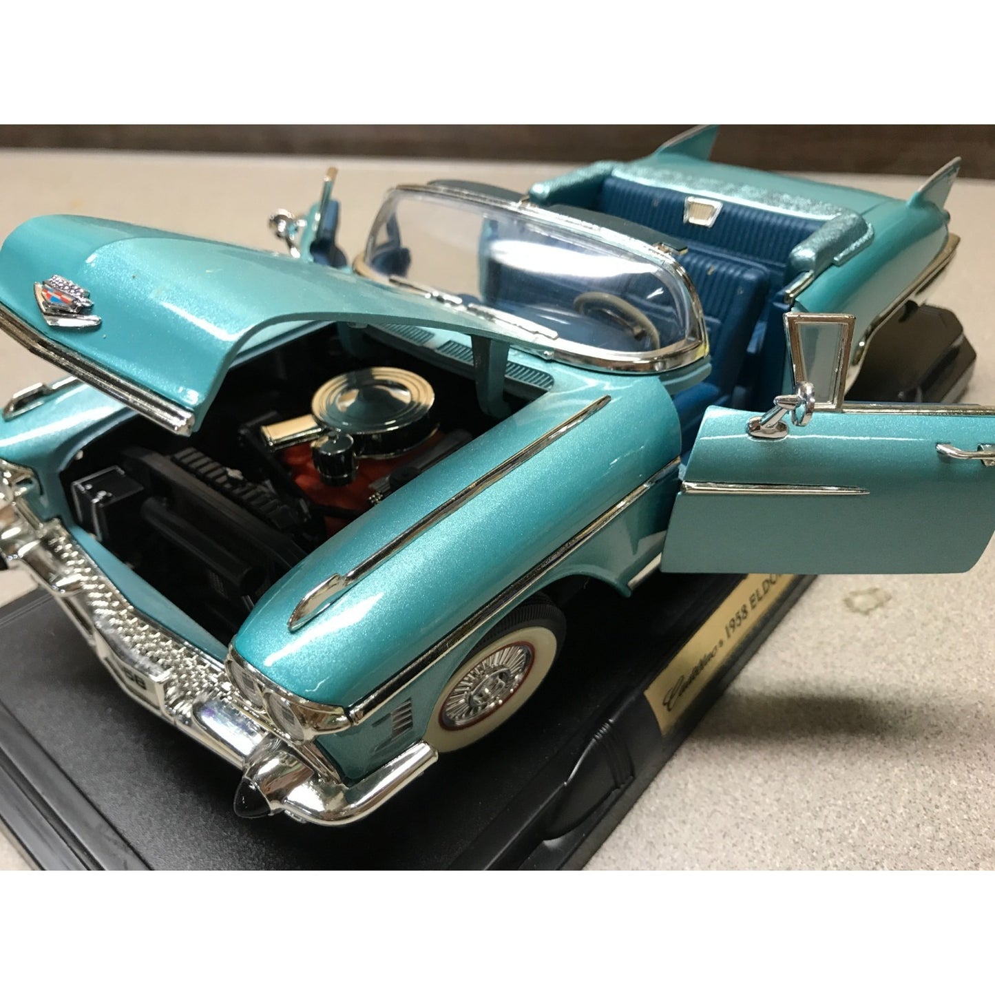 1958 Cadillac Eldorado Biarritz Aqua/Teal Road Legends Die Cast 1:18 Scale on Stand  closeup of front end view with hood and doors open