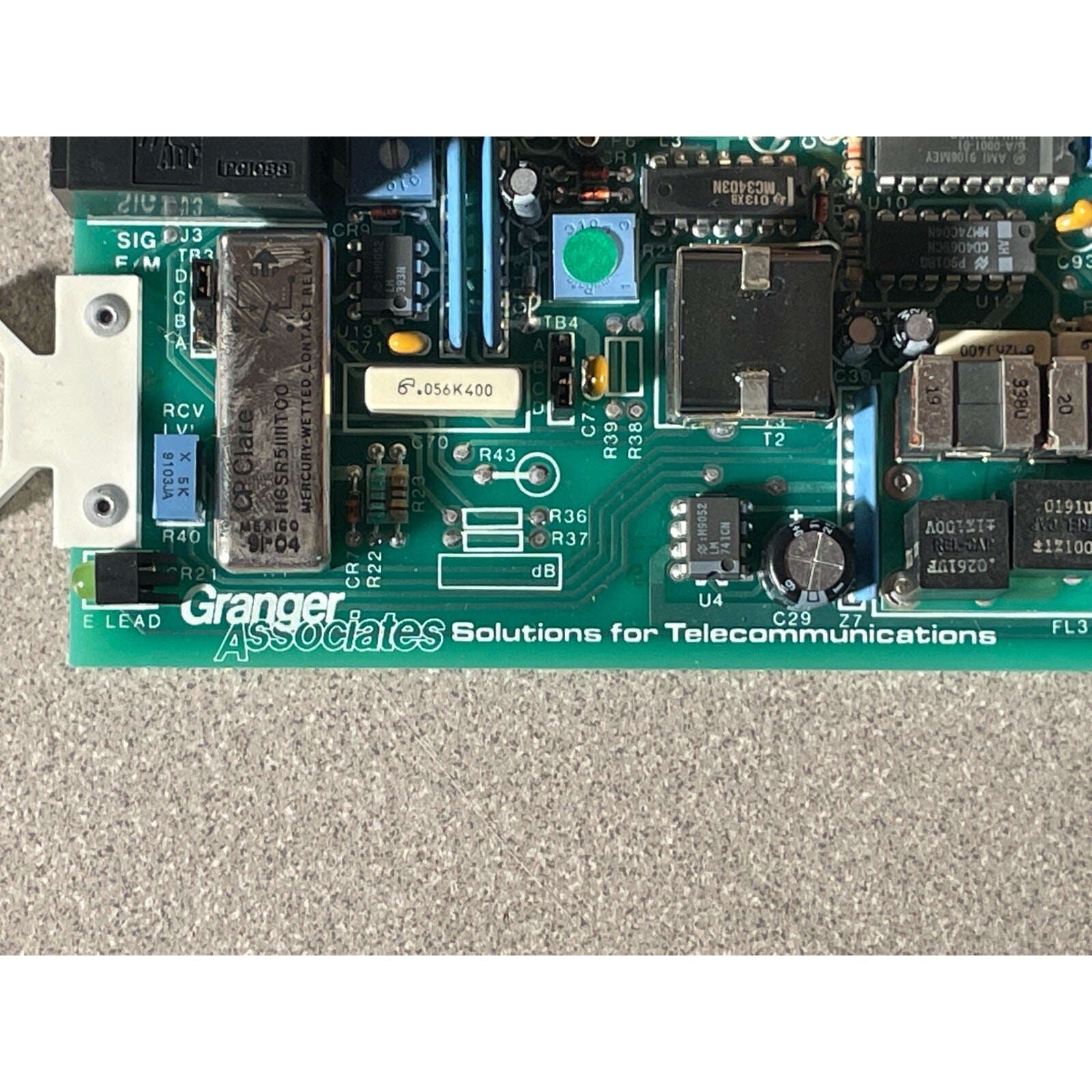 GRANGER ASSOCIATES DTL-7300 CHANNEL MODEM MODEL 4 ASSY 065-2795-II MODEL 4 manufacturer stamp closeup