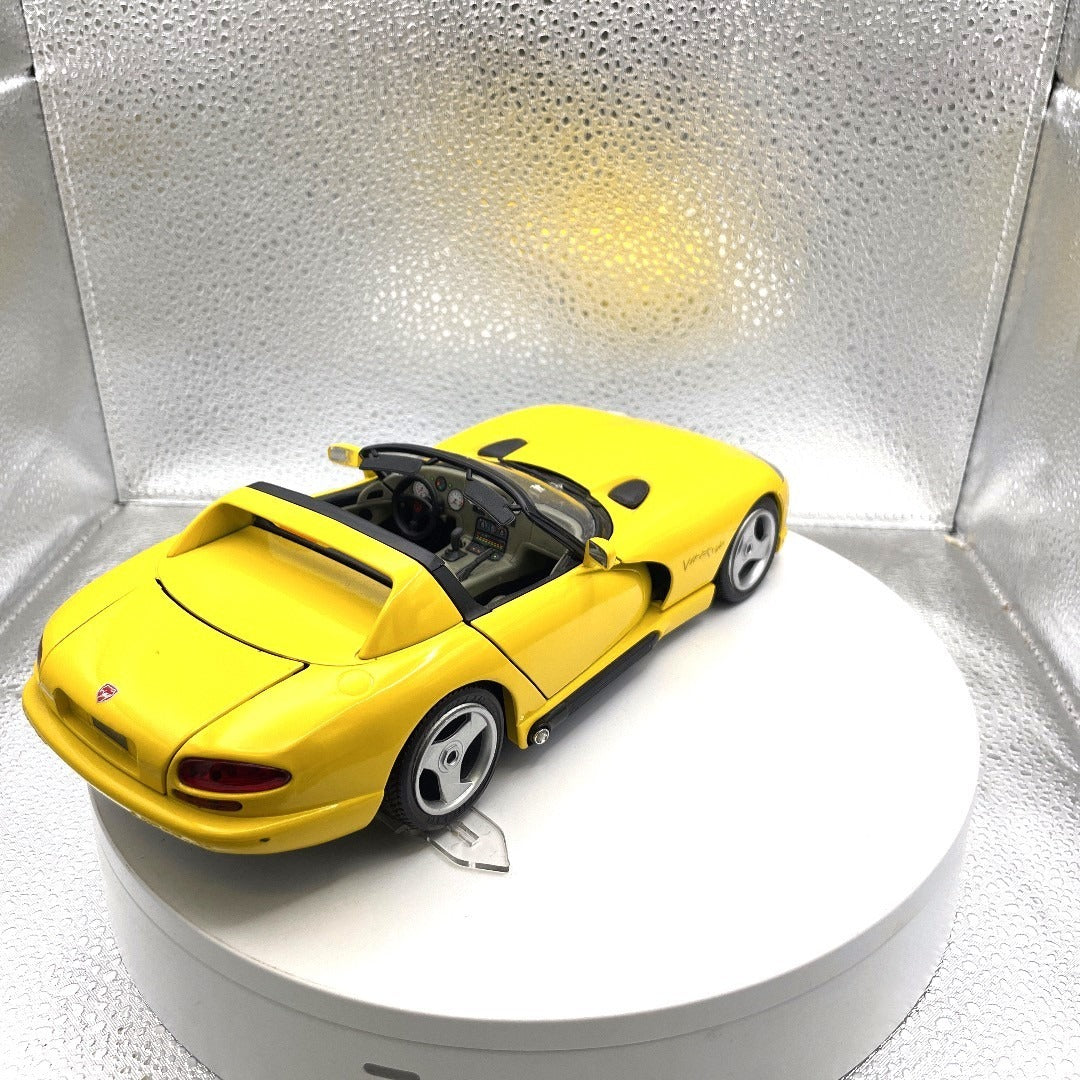 Burago 1993 Dodge Viper RT/10 Yellow Convertible Die Cast, Scale: 1/18 back end/passenger side view