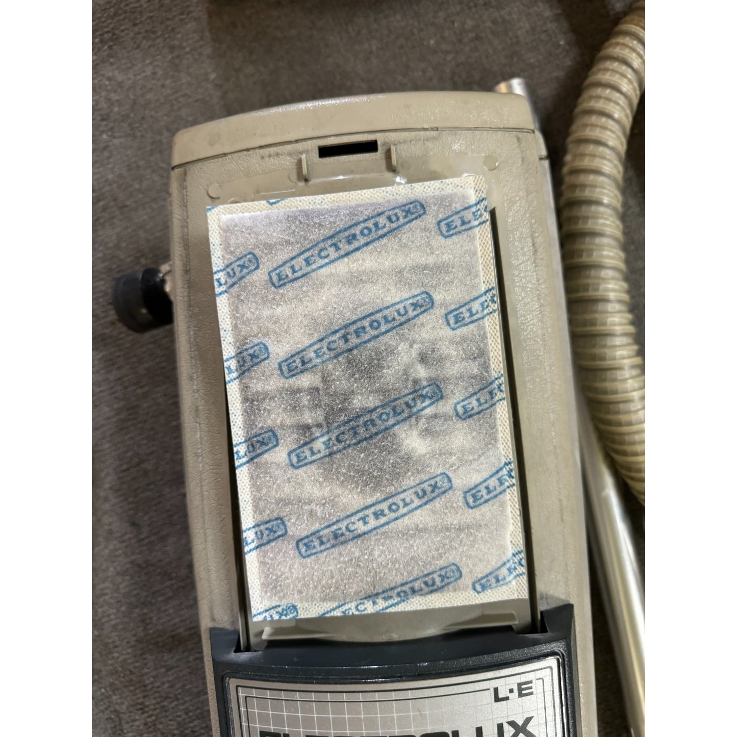 Electrolux vacuum cleaner filter on a carpeted floor