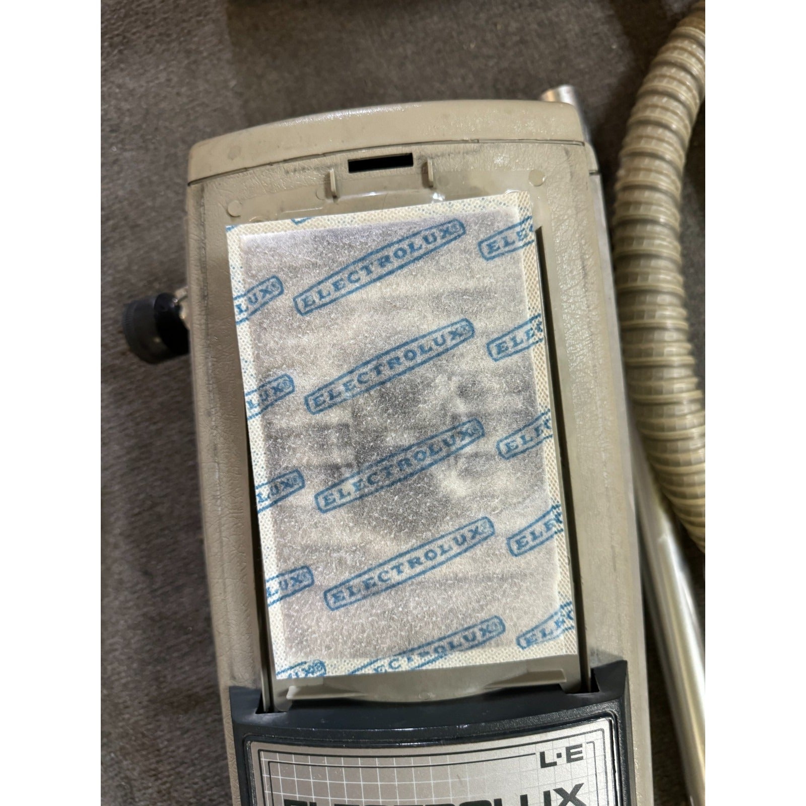 Electrolux vacuum cleaner filter on a carpeted floor